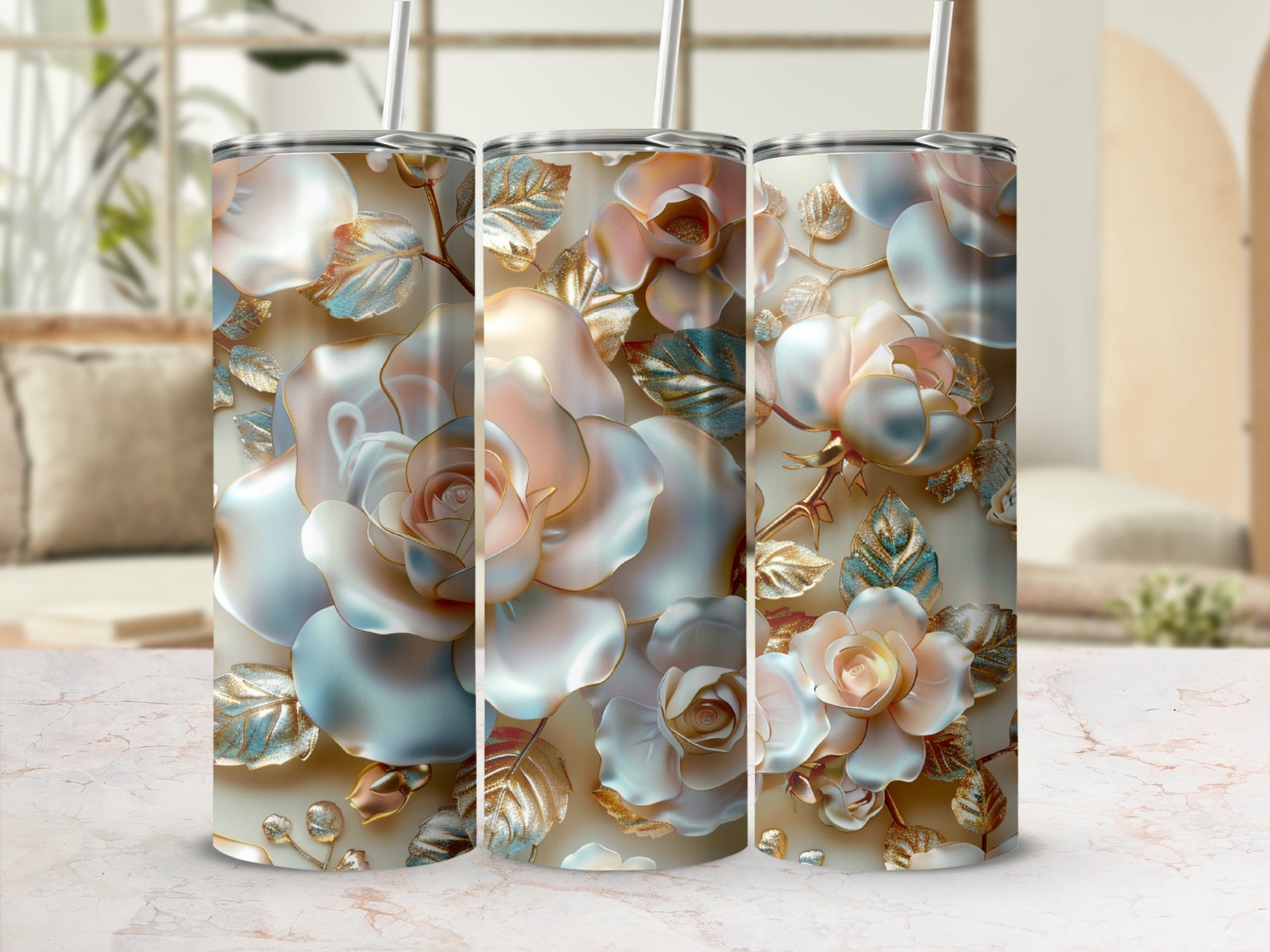 Three iridescent rose tumblers with gold leaf accents, displayed on a marble surface.