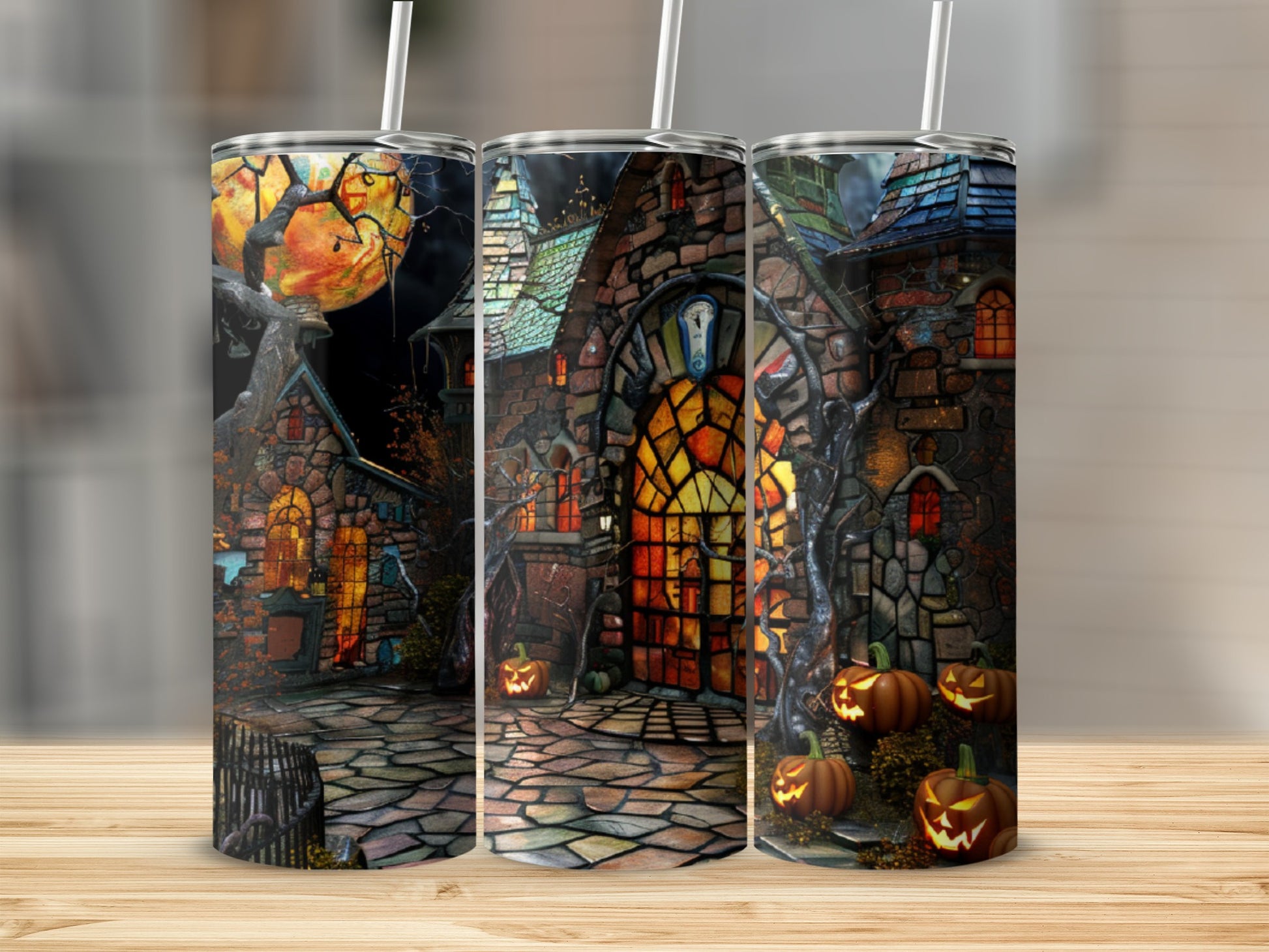 Spooky Halloween tumbler with haunted house and pumpkins.
