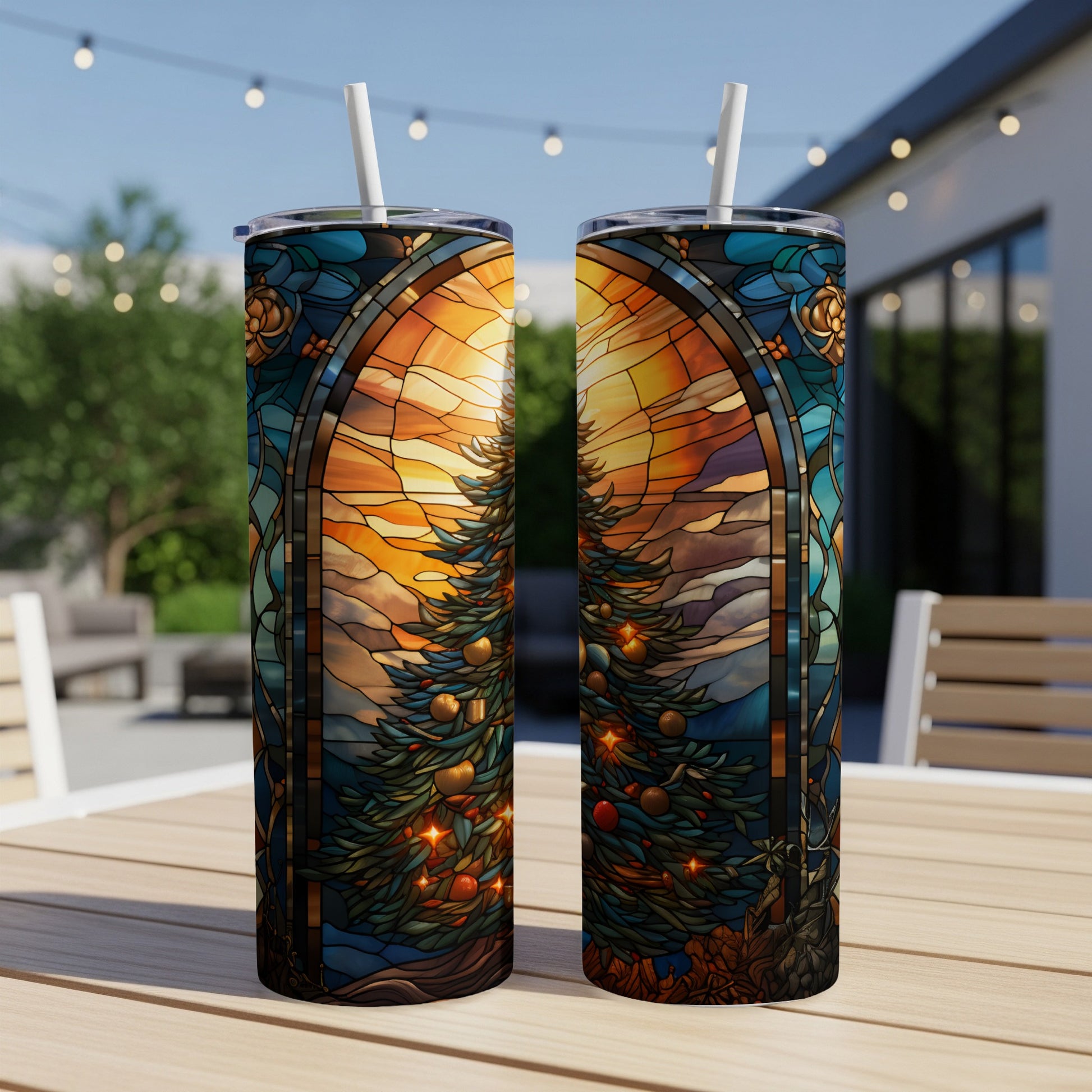 Stained glass tumbler with Christmas tree and sunset design.