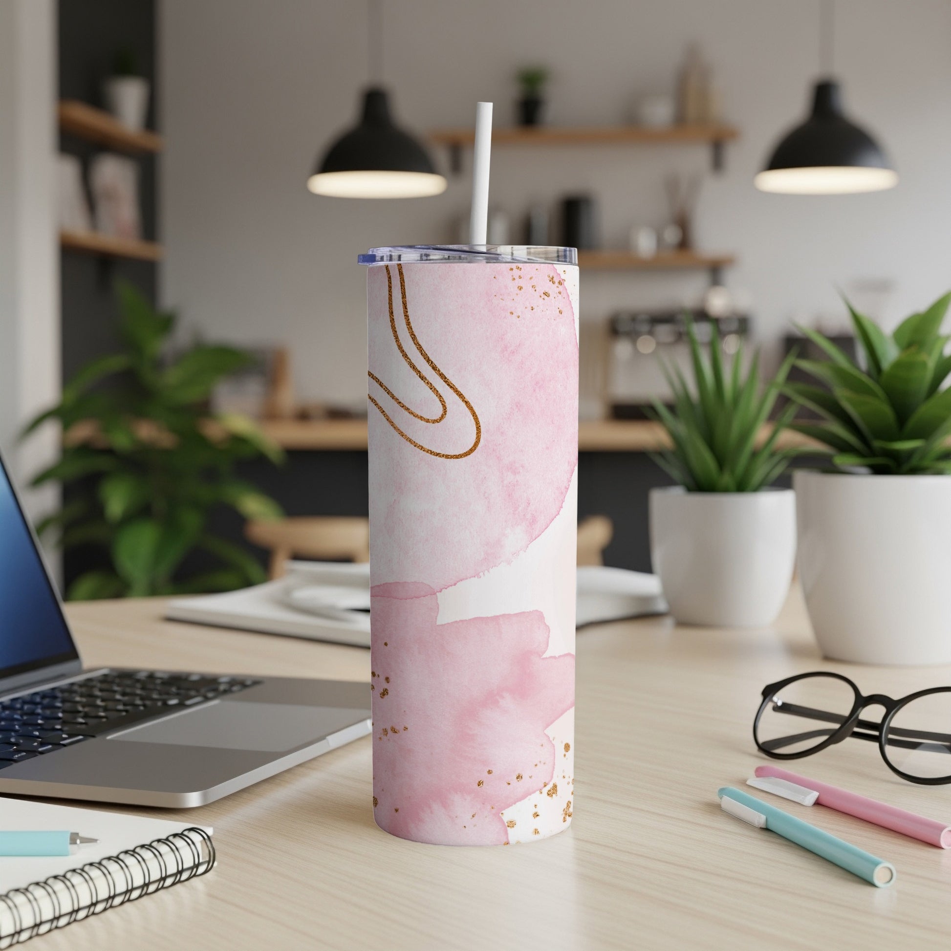 Pink watercolor tumbler with gold accents and a white straw.