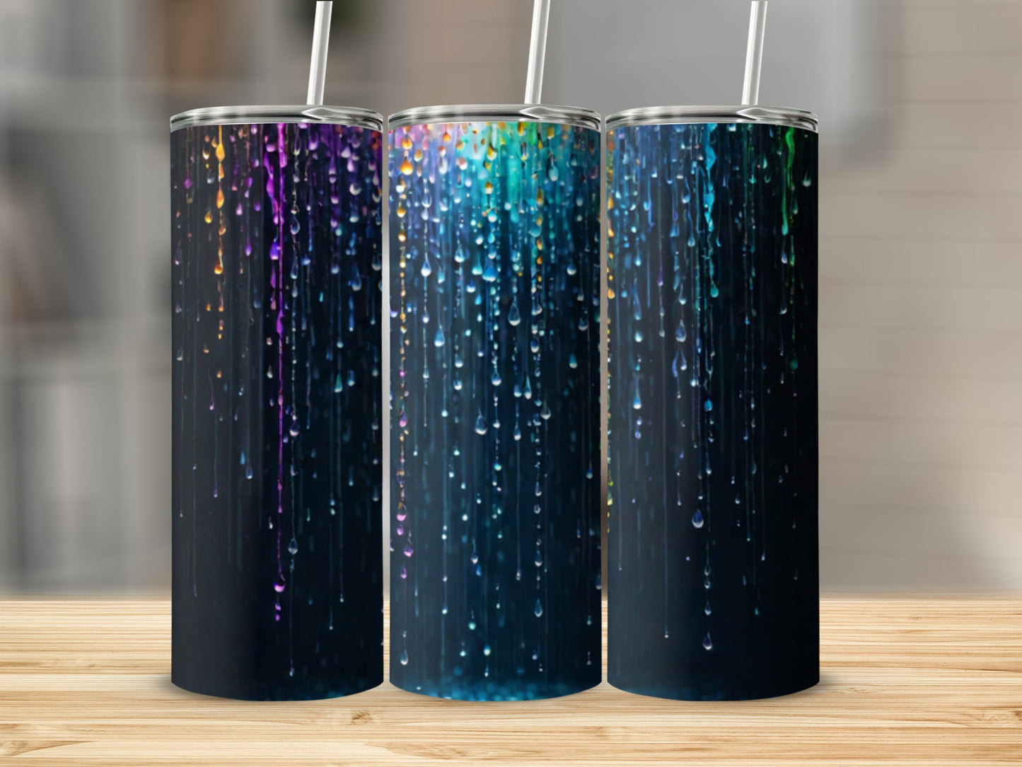 Three tumblers with colorful dripping paint designs.