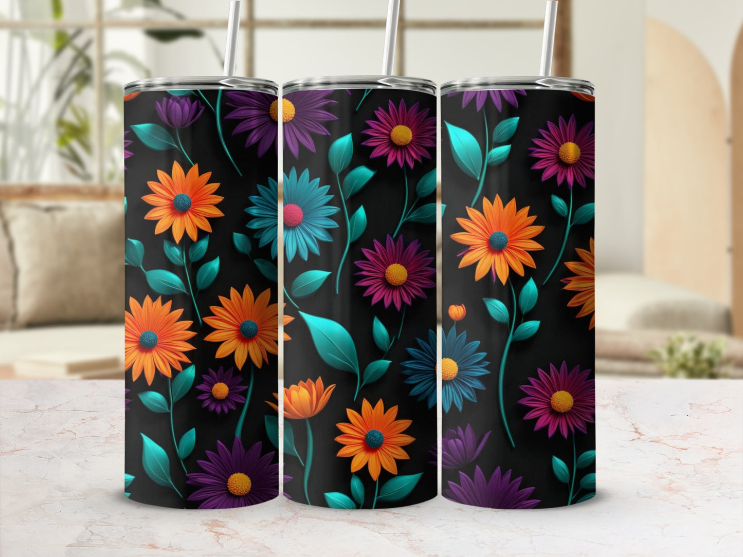 Three tumblers with a floral pattern of orange, purple, and teal flowers on a black background.