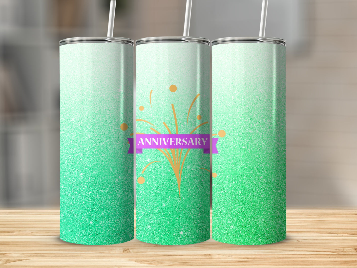 Green glitter tumbler with "Anniversary" ribbon and orange sparkles.