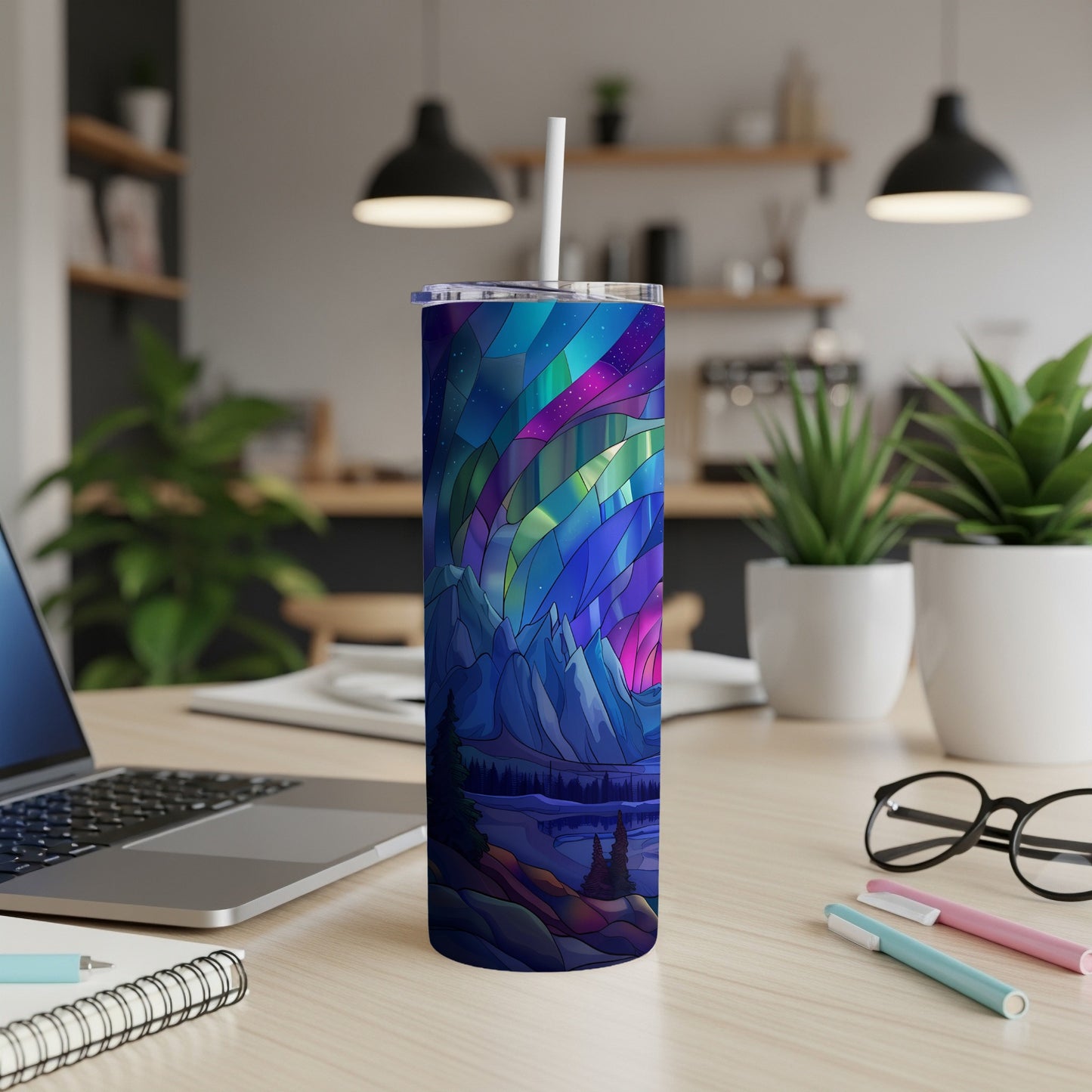 Tumbler with aurora borealis, mountains, and trees design.