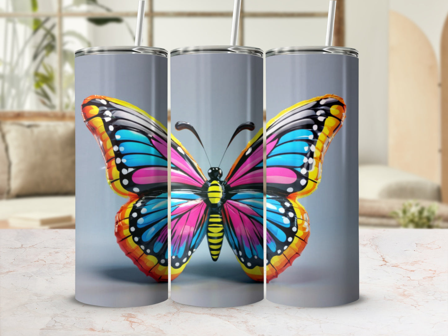 Colorful butterfly design on a set of three tumblers.