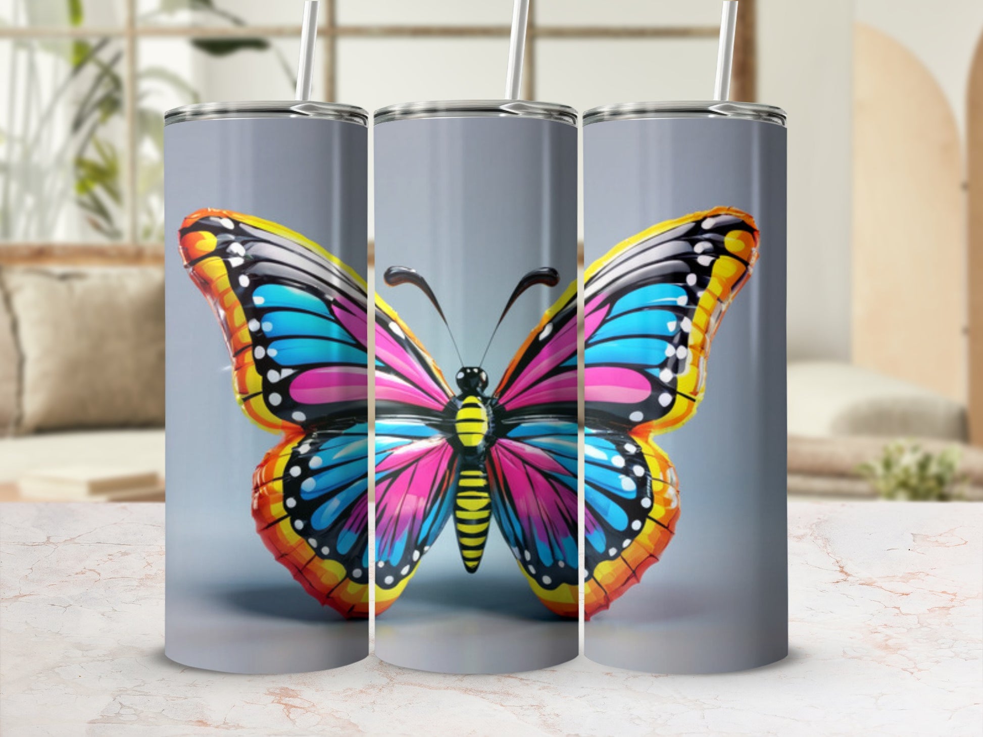 Colorful butterfly design on a set of three tumblers.