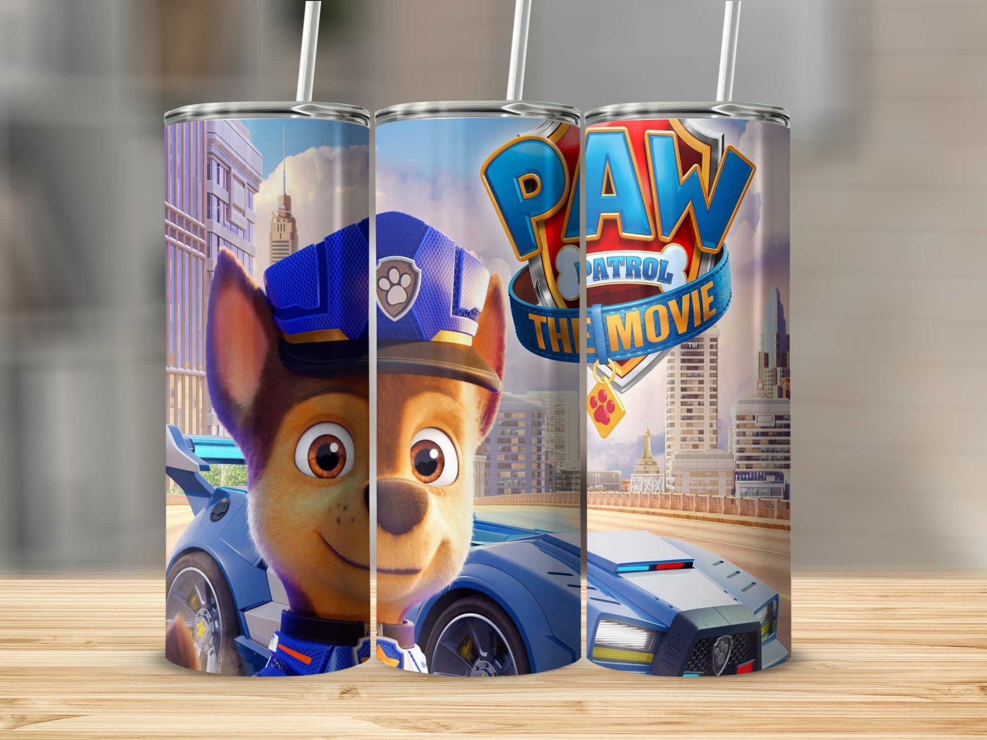 Paw Patrol The Movie Chase character on a blue race car, on a tumbler.