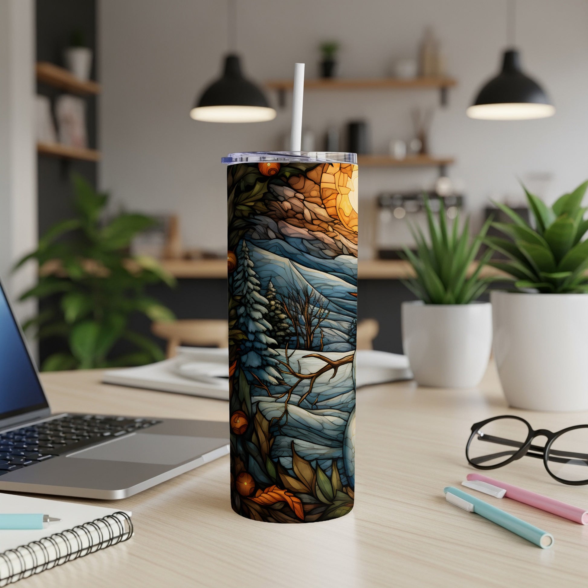 Winter forest scene on a white insulated tumbler with a straw.