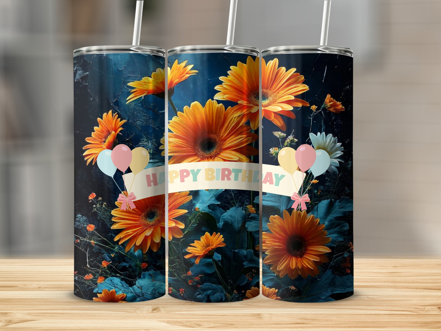 Three tumblers with orange gerbera daisies and balloons, "Happy Birthday" text.