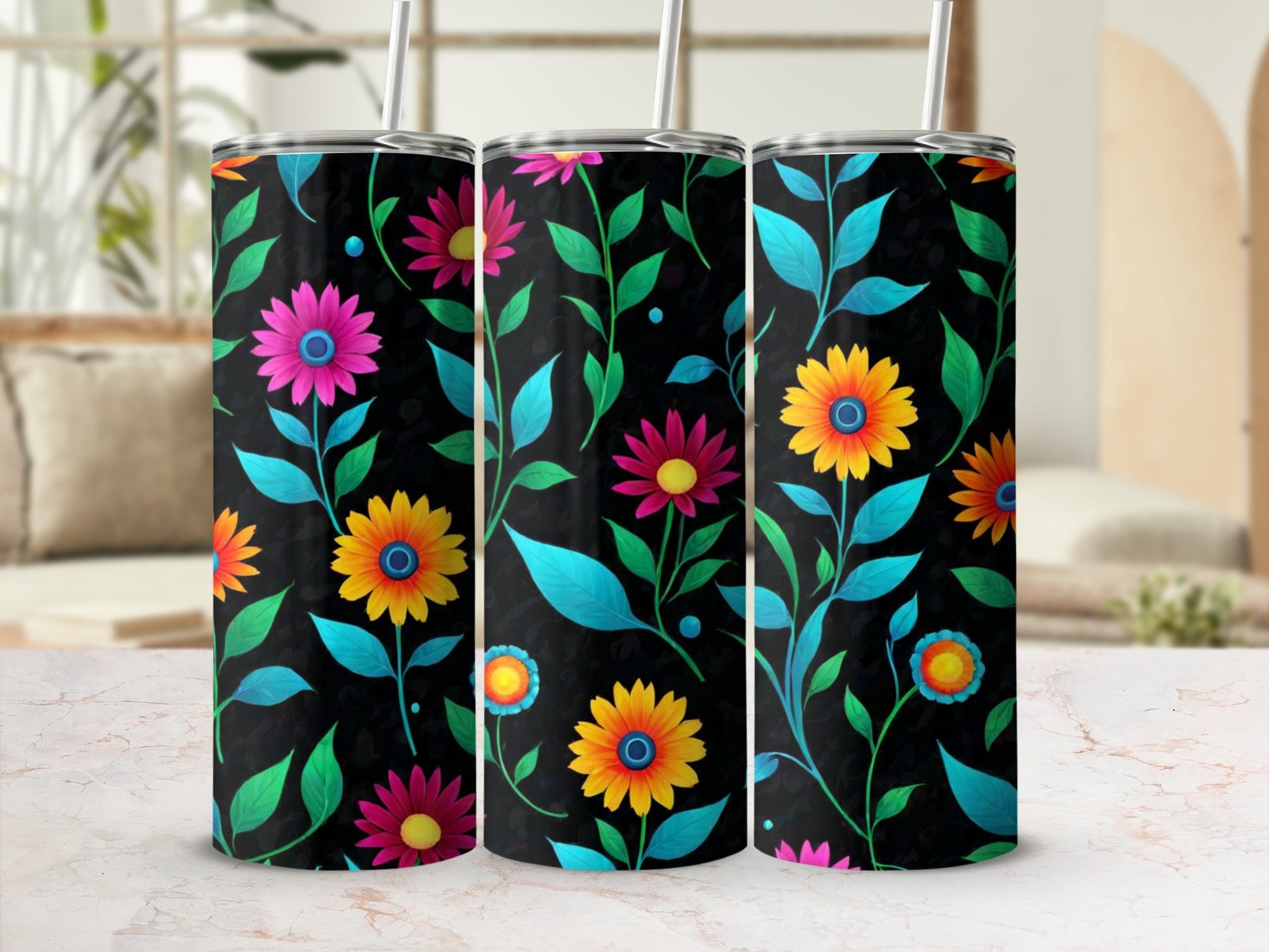 Three black tumblers with colorful floral and leaf patterns.