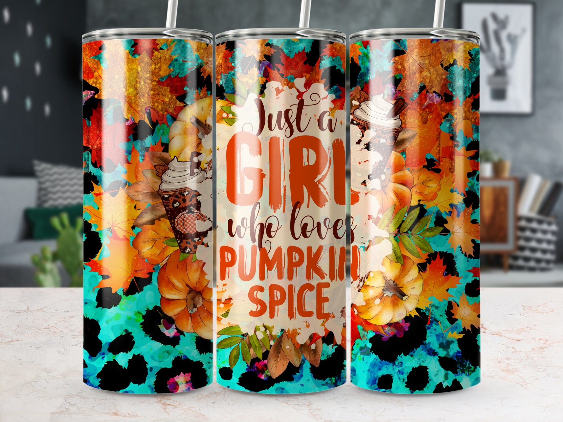 Tumbler with "Just a girl who loves pumpkin spice" text and fall leaves.