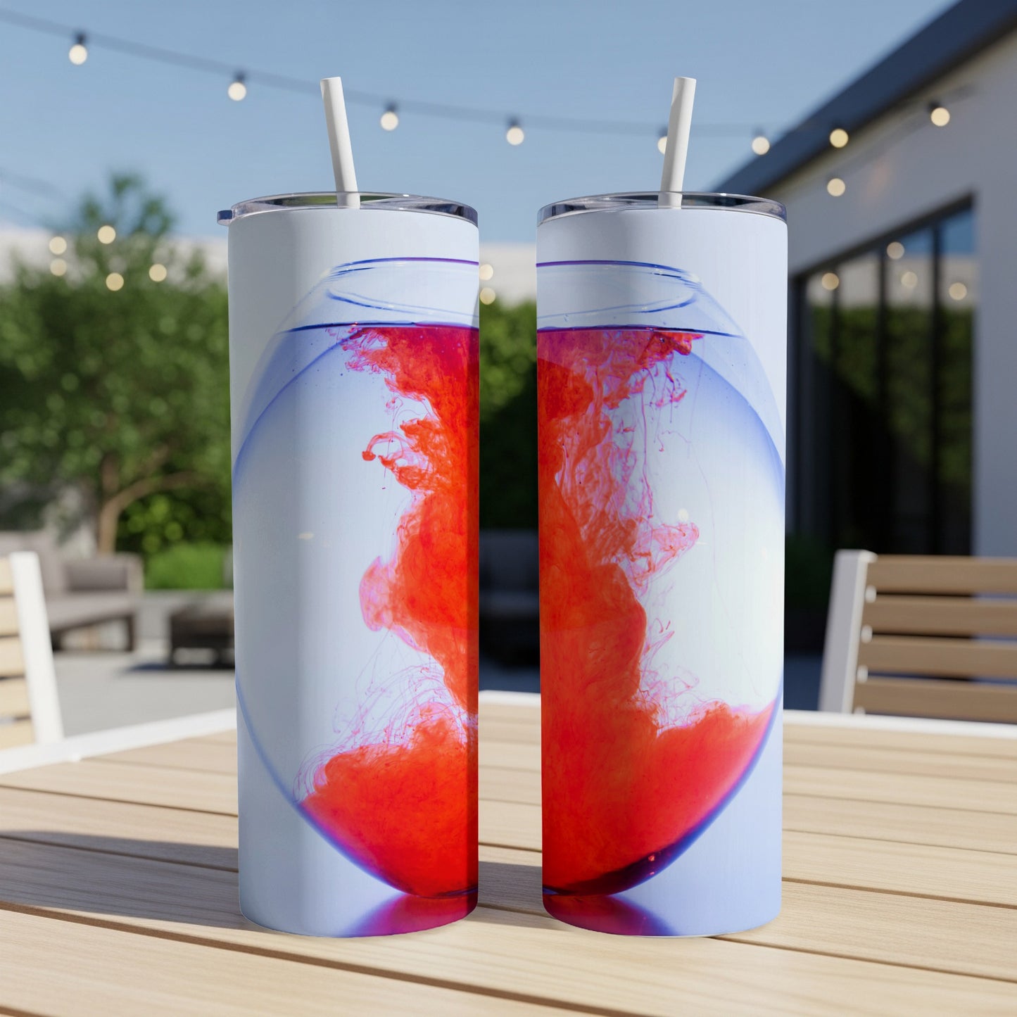 Two tumblers with red ink dissolving in water.