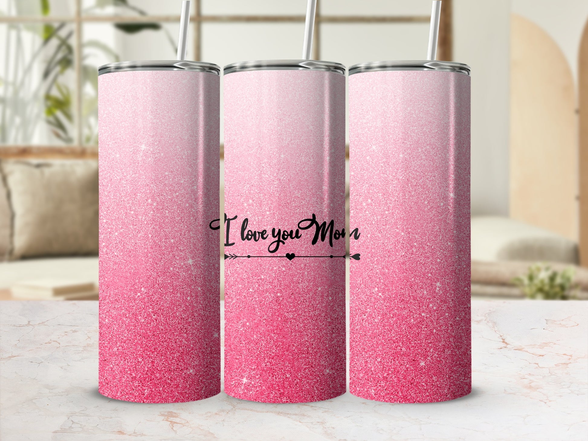 Pink glitter tumbler with "I love you mom" text.