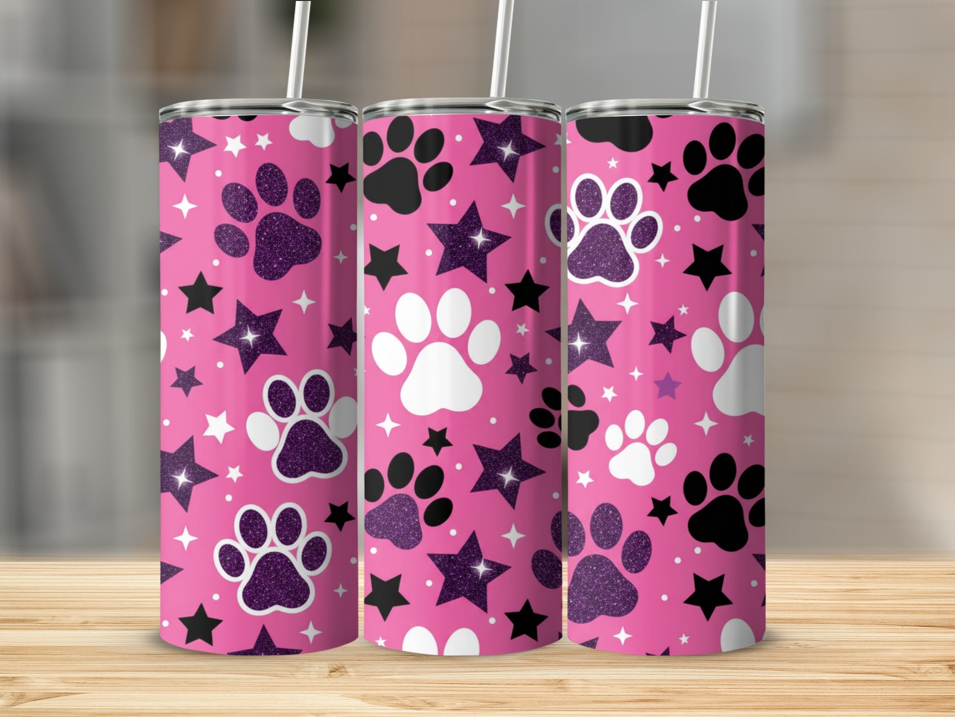 Pink tumbler with paw prints and stars.