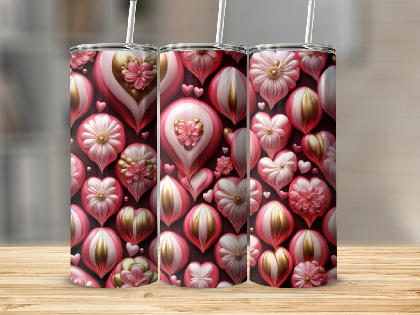 Three pink and gold Valentine's Day themed tumblers with heart and floral patterns.
