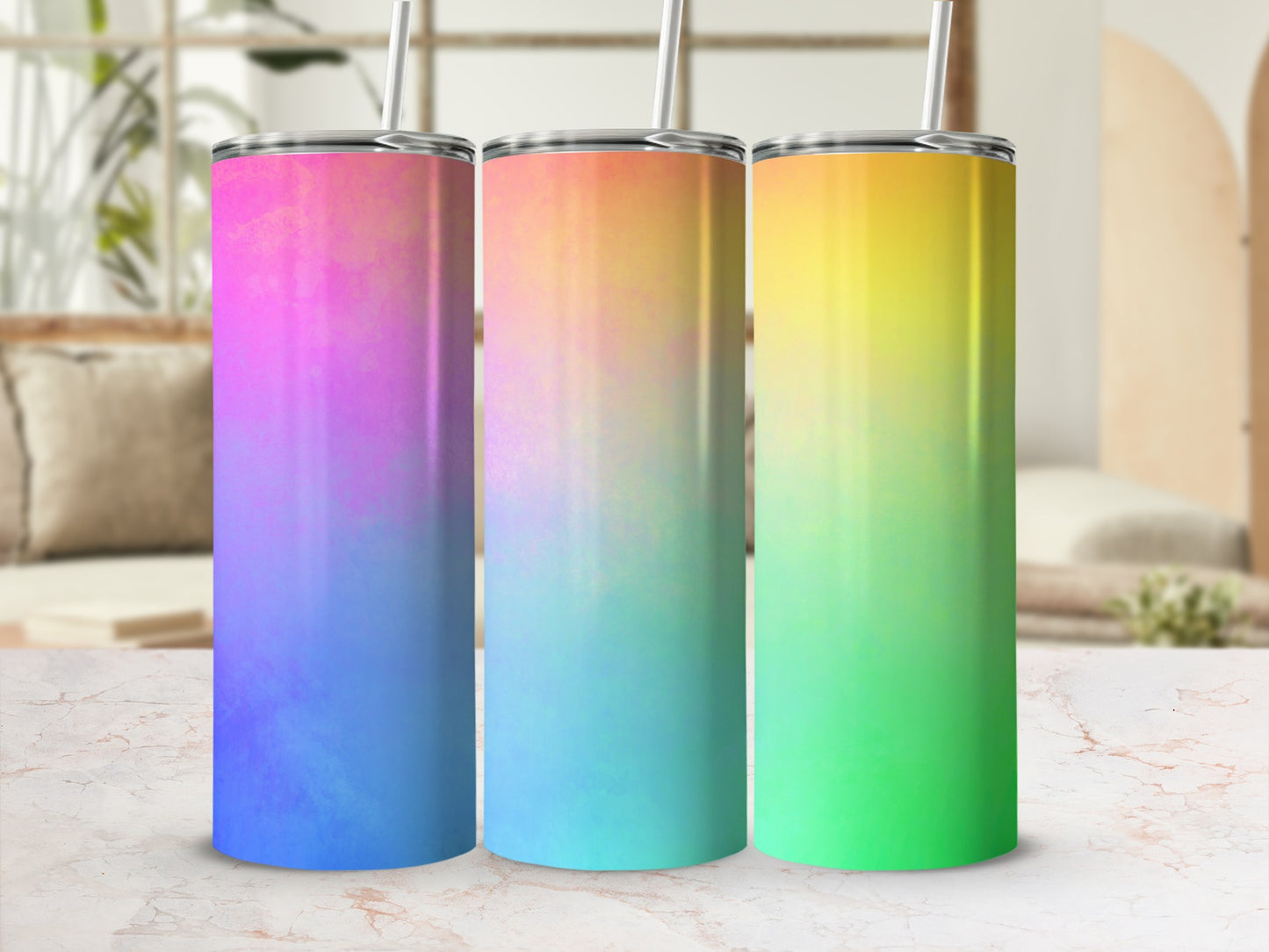 Three tumblers with a pink-to-blue, blue-to-orange, and orange-to-yellow gradient.