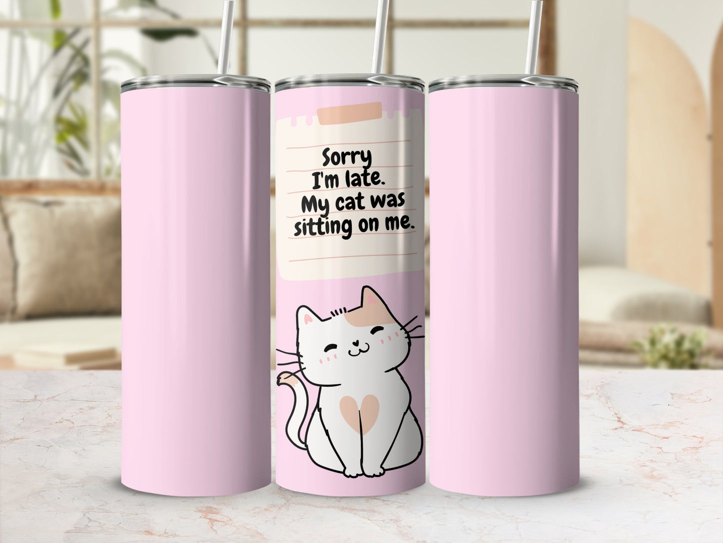 Pink tumbler with cat illustration and text "Sorry I'm late. My cat was sitting on me."