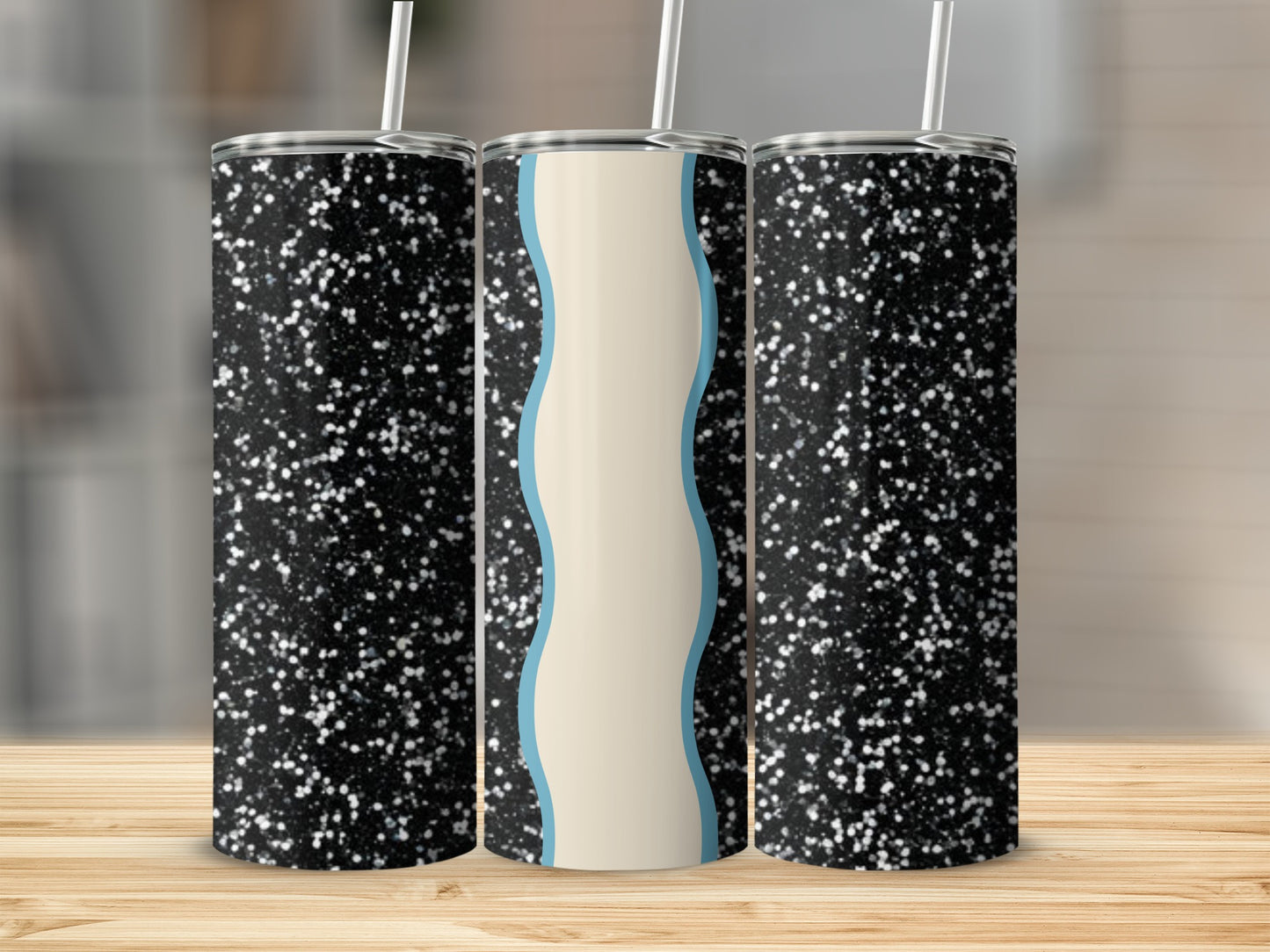 Three tumblers with black glitter and light blue wavy center panel.
