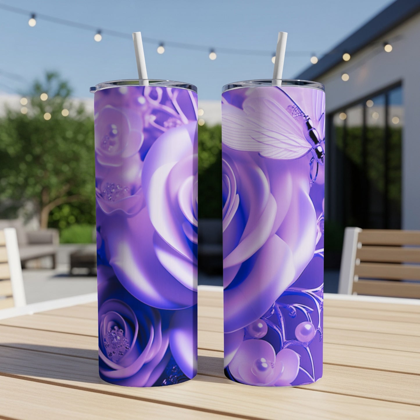 Purple floral and butterfly design on two tall tumblers with straws.
