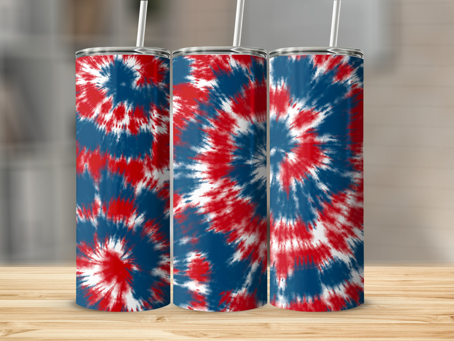 Three tumblers with a red, white, and blue tie-dye design stand side-by-side.