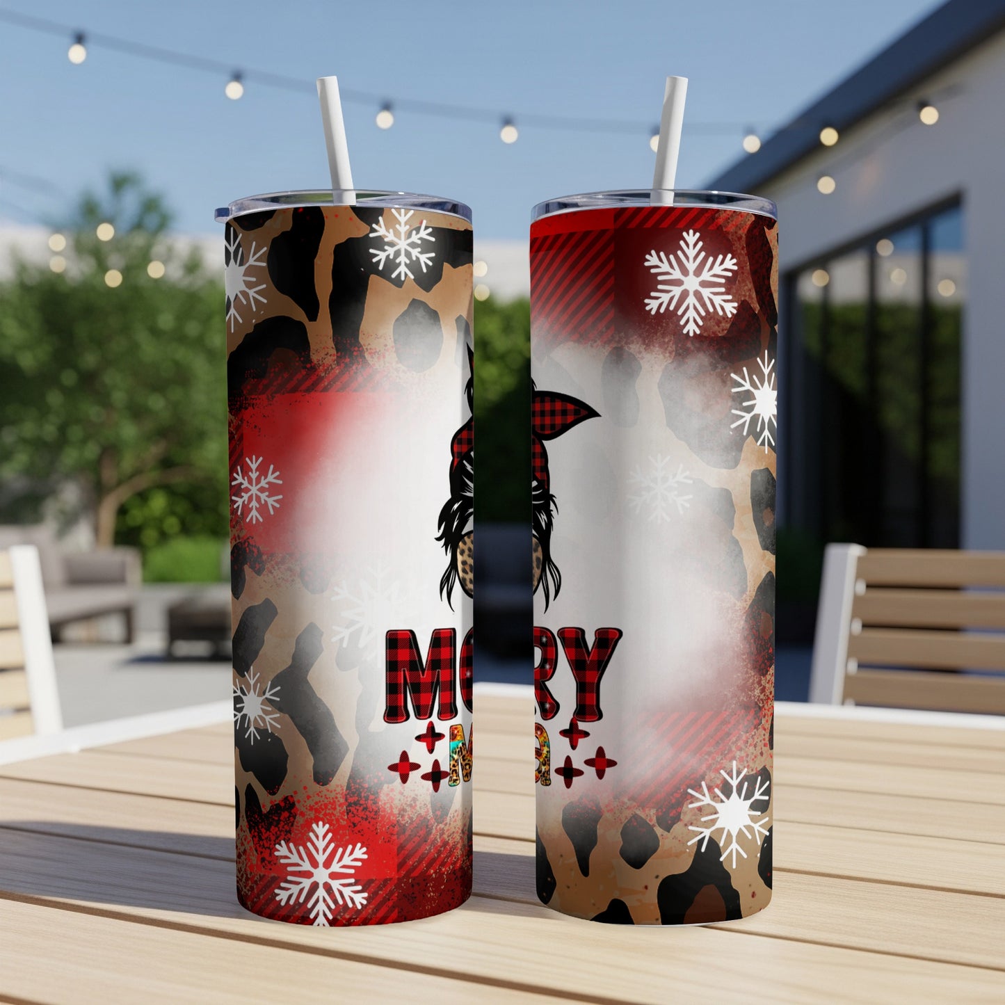 Two tumblers with leopard, plaid, and snowflake Christmas patterns.