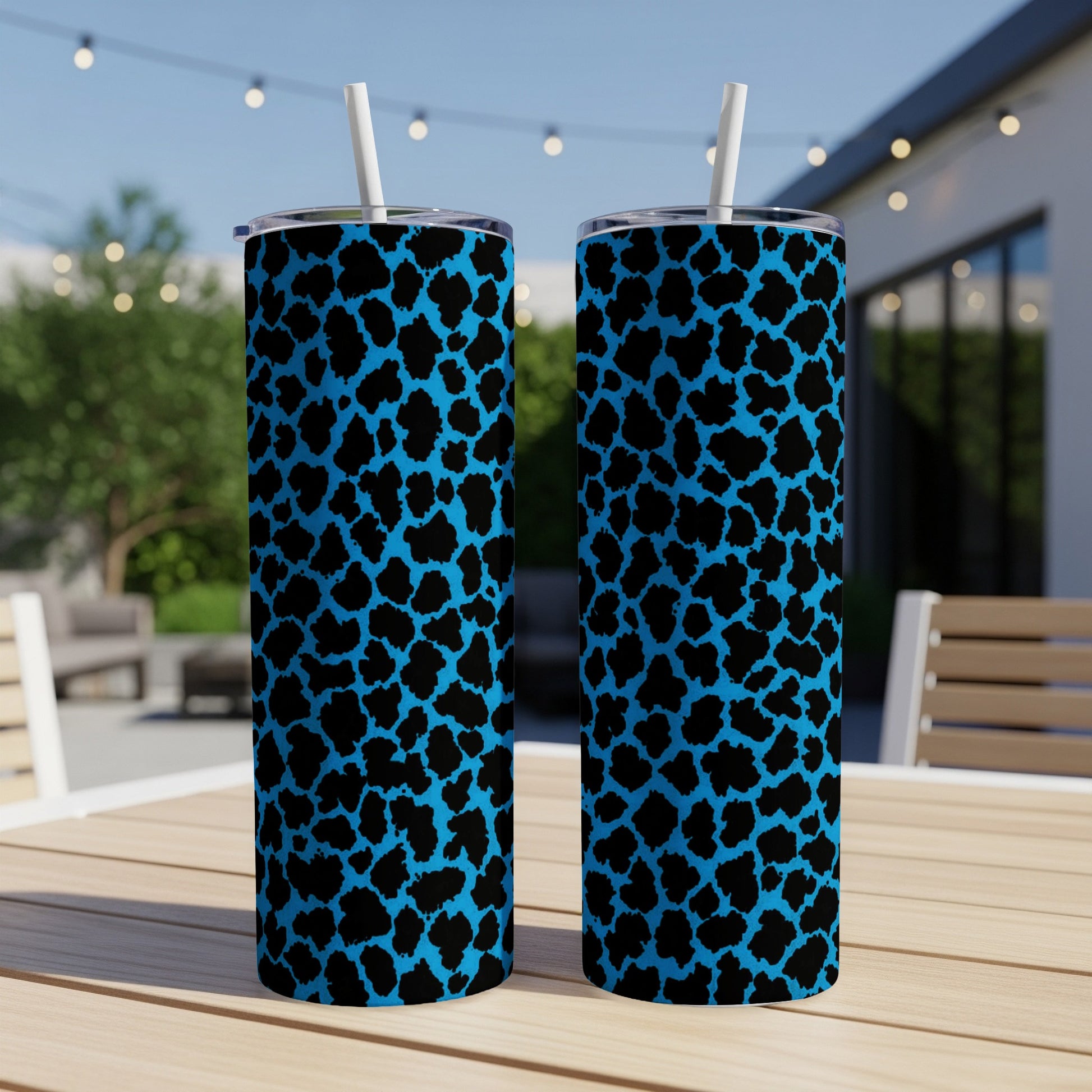 Two tall tumblers with a blue and black leopard print pattern.