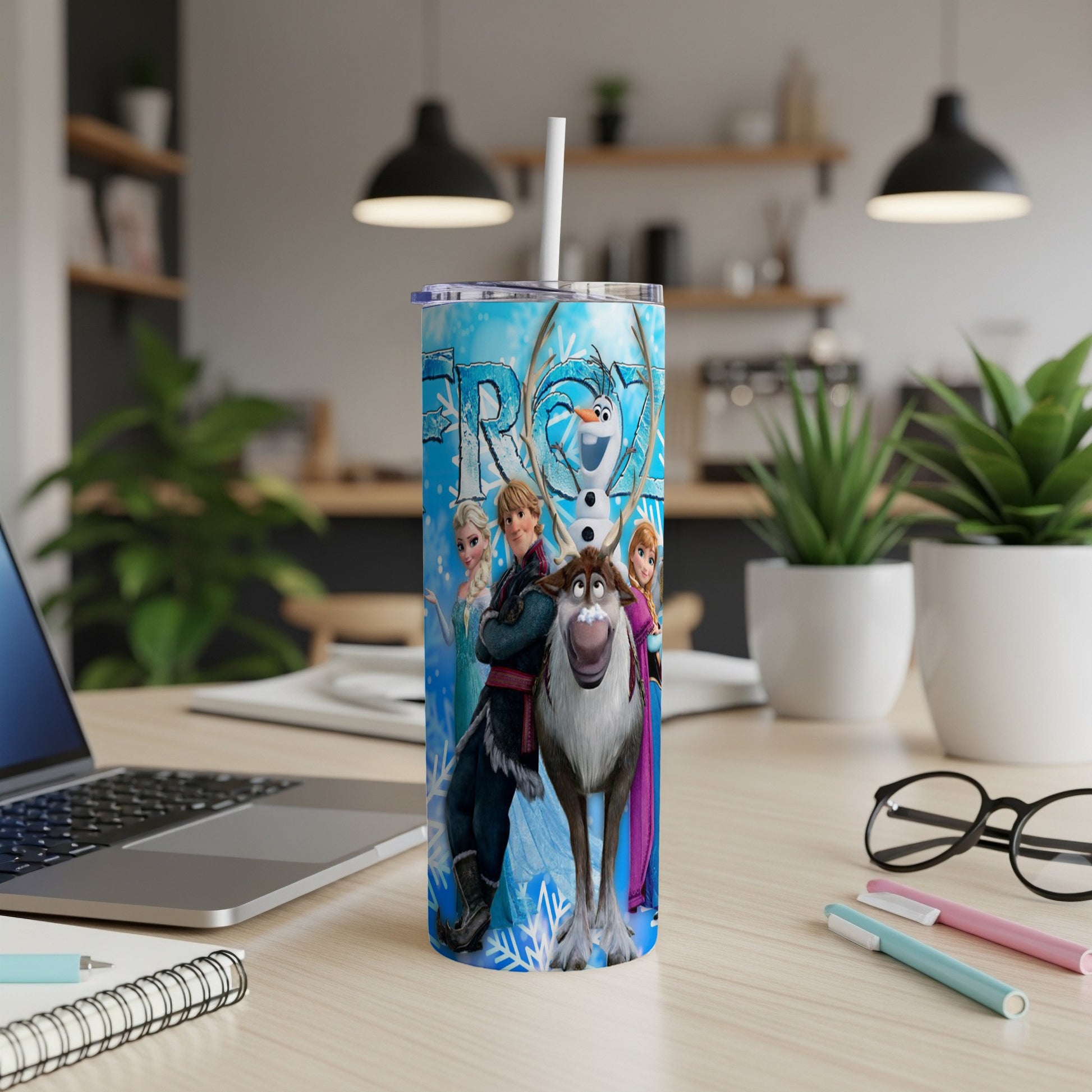 Frozen characters Elsa, Anna, Kristoff, and Sven on a blue tumbler.