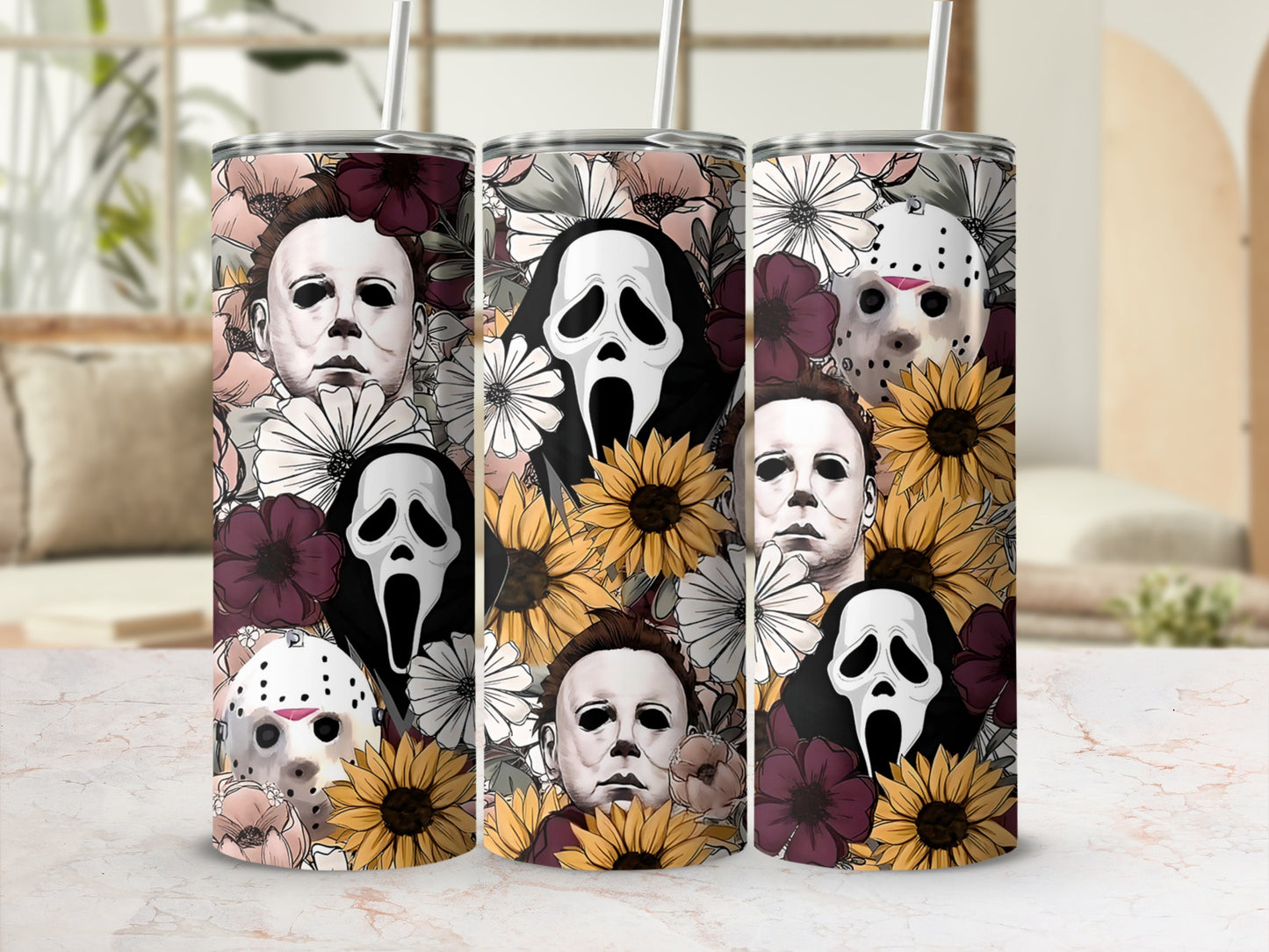 Three tumblers feature horror movie characters and floral designs.
