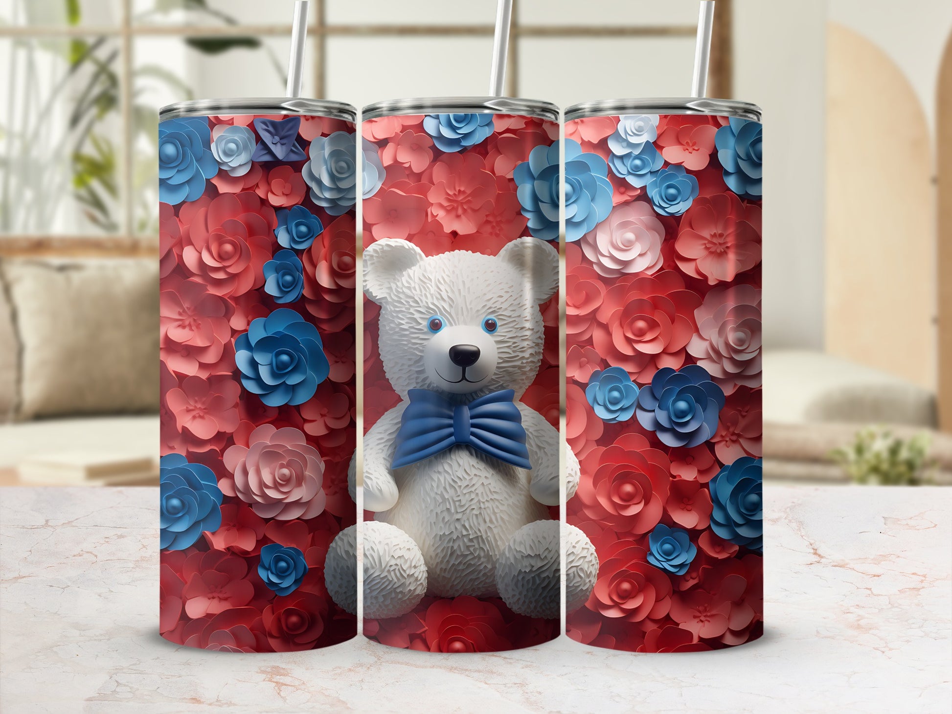 Three tumblers featuring a teddy bear with a blue bow on a floral background.