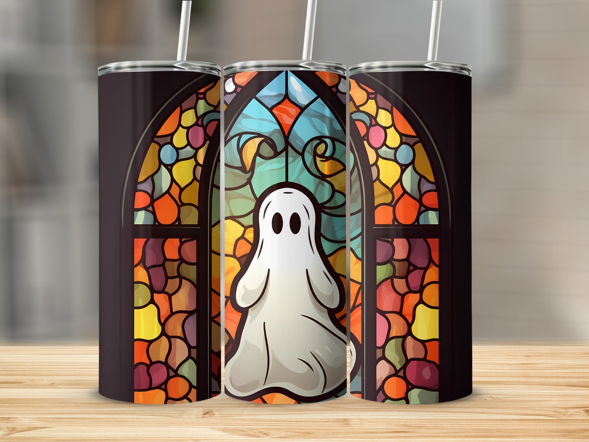 Ghost in stained glass window design on three tumblers.