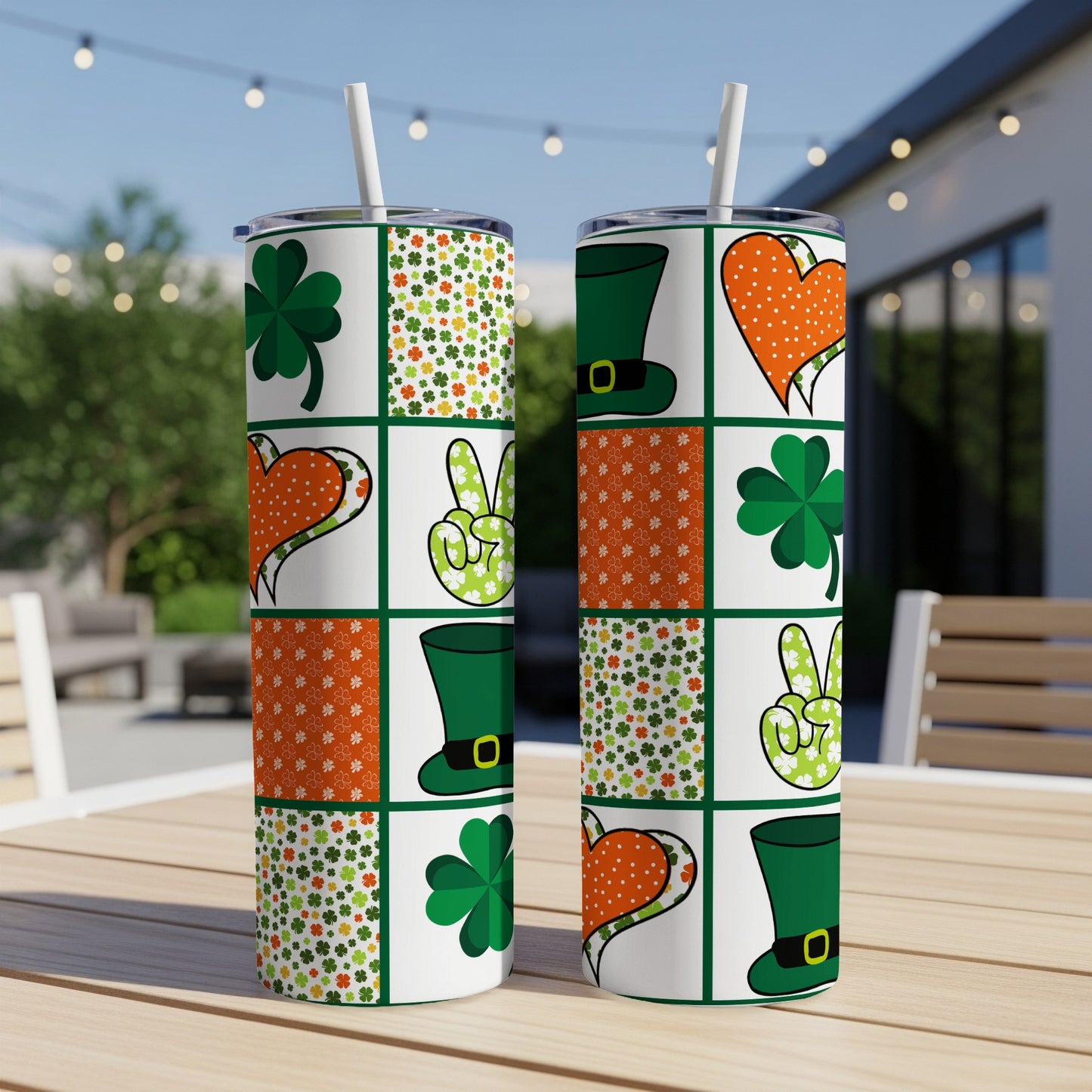 Two St. Patrick's Day themed tumblers with shamrocks, hearts, and top hats.
