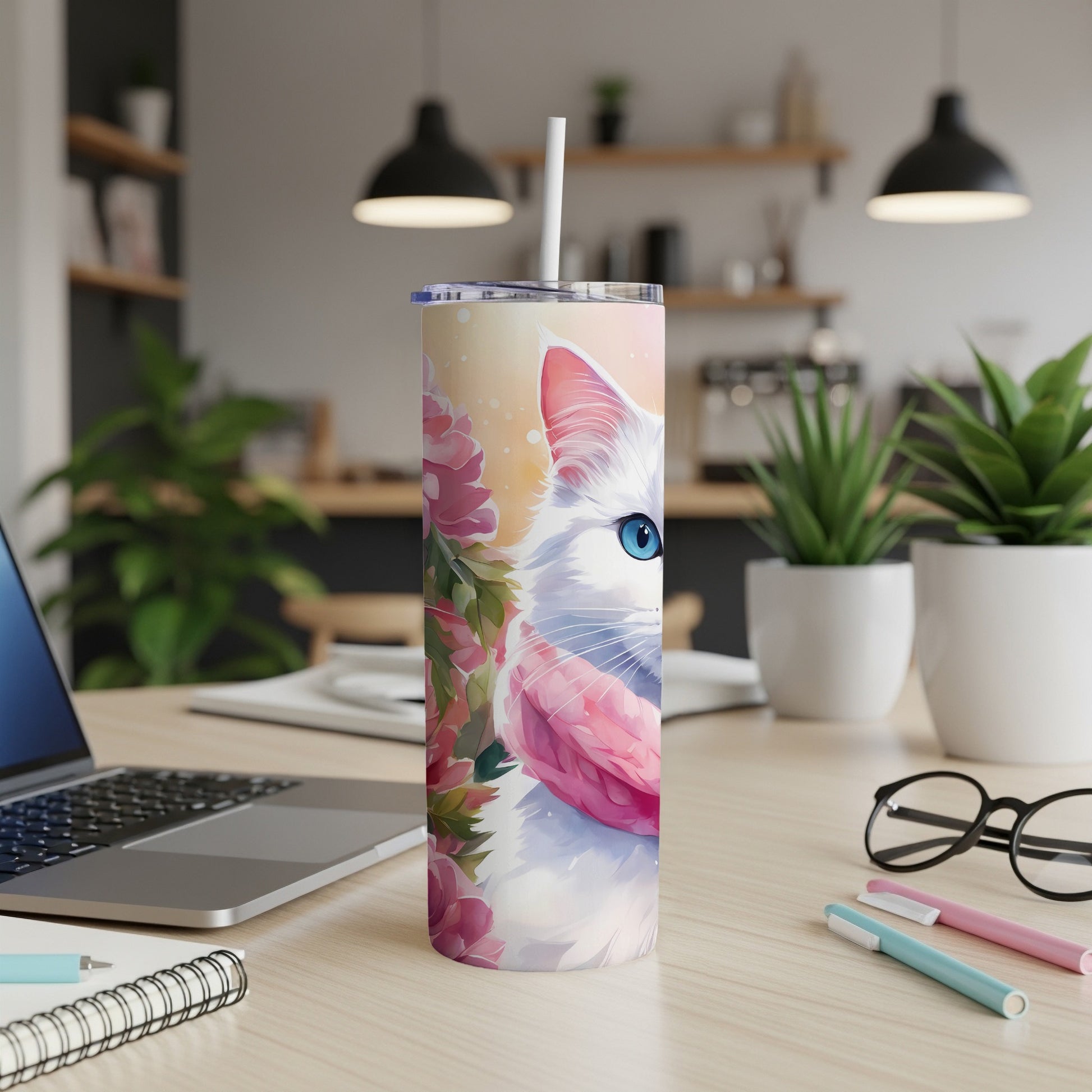 White cat with blue eyes on a floral tumbler with a pink scarf.