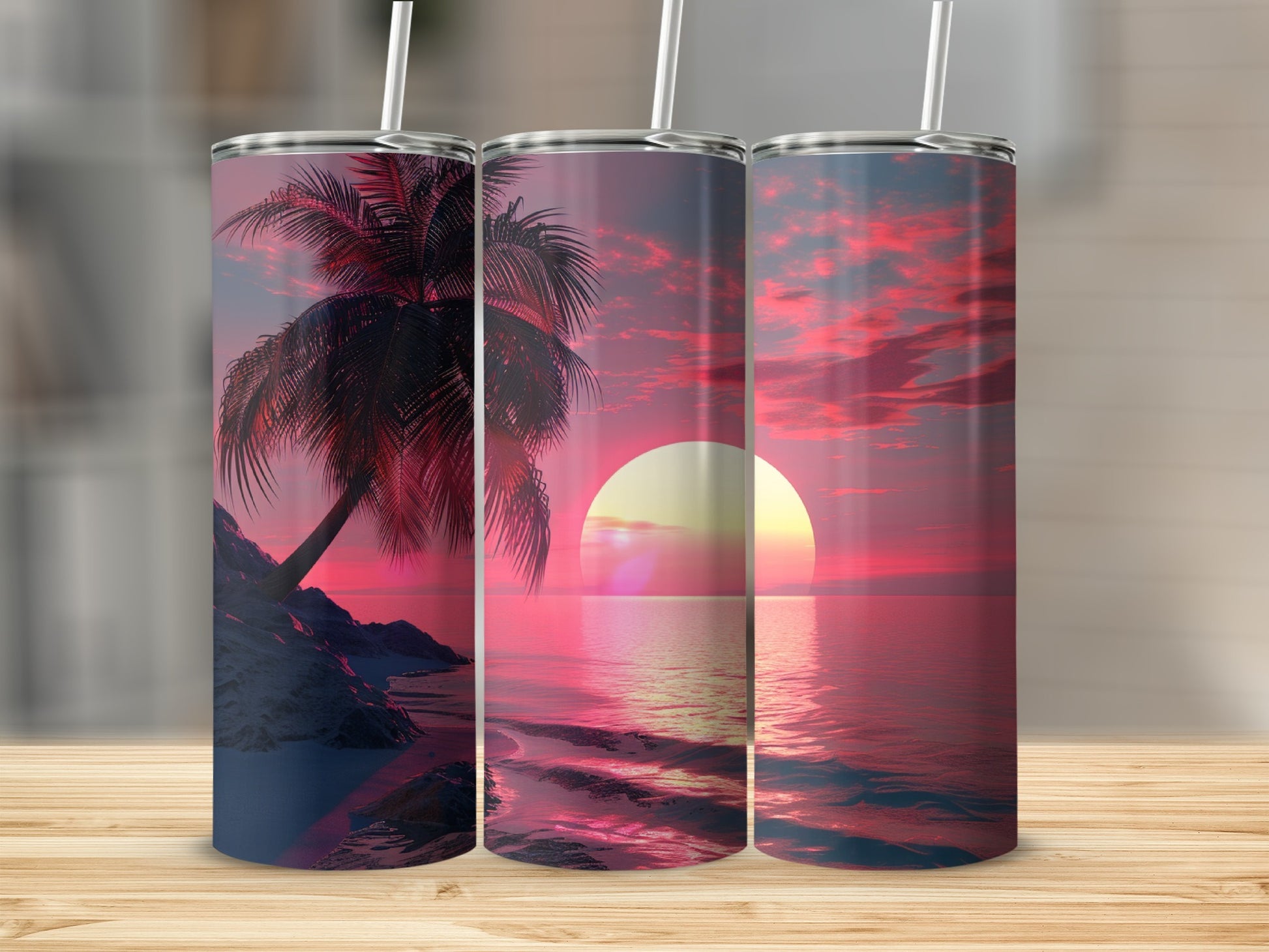 Three tumblers with a vibrant sunset over the ocean and palm trees.