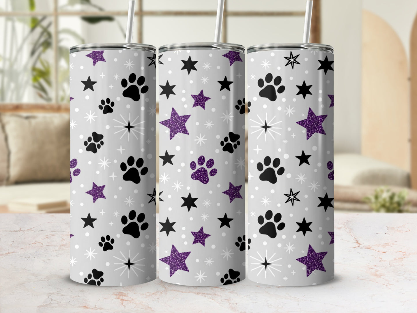 Gray tumbler with purple paw prints and glitter stars pattern.