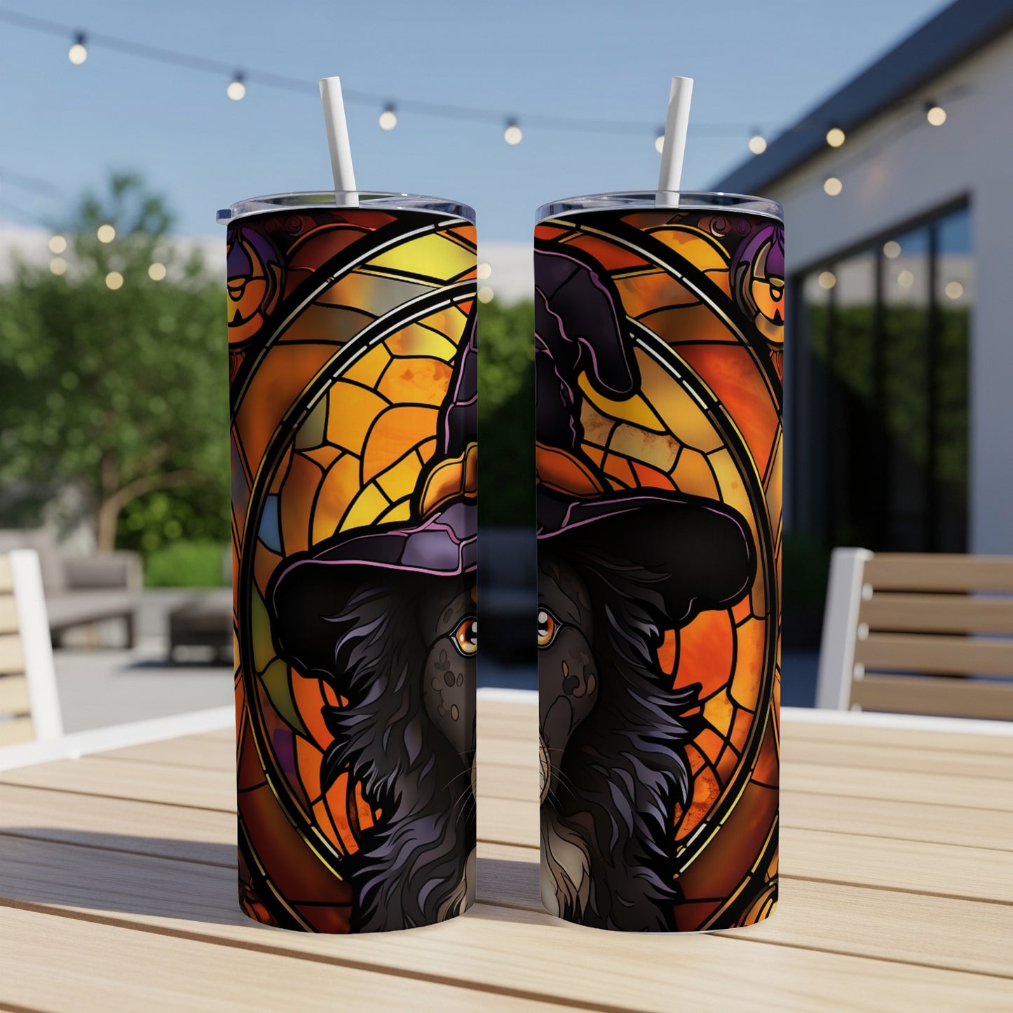 Black dog with witch hat in stained glass design on two tumblers.