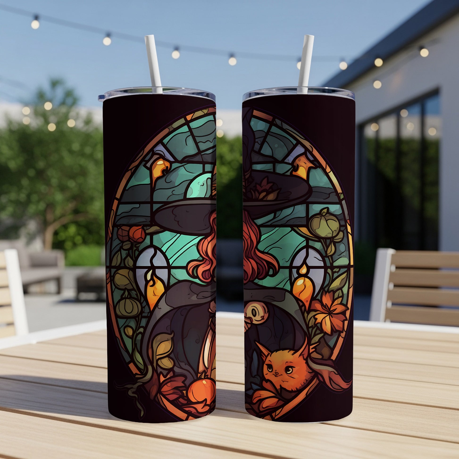 Stained glass art featuring a witch, cat, and pumpkins on a tumbler.