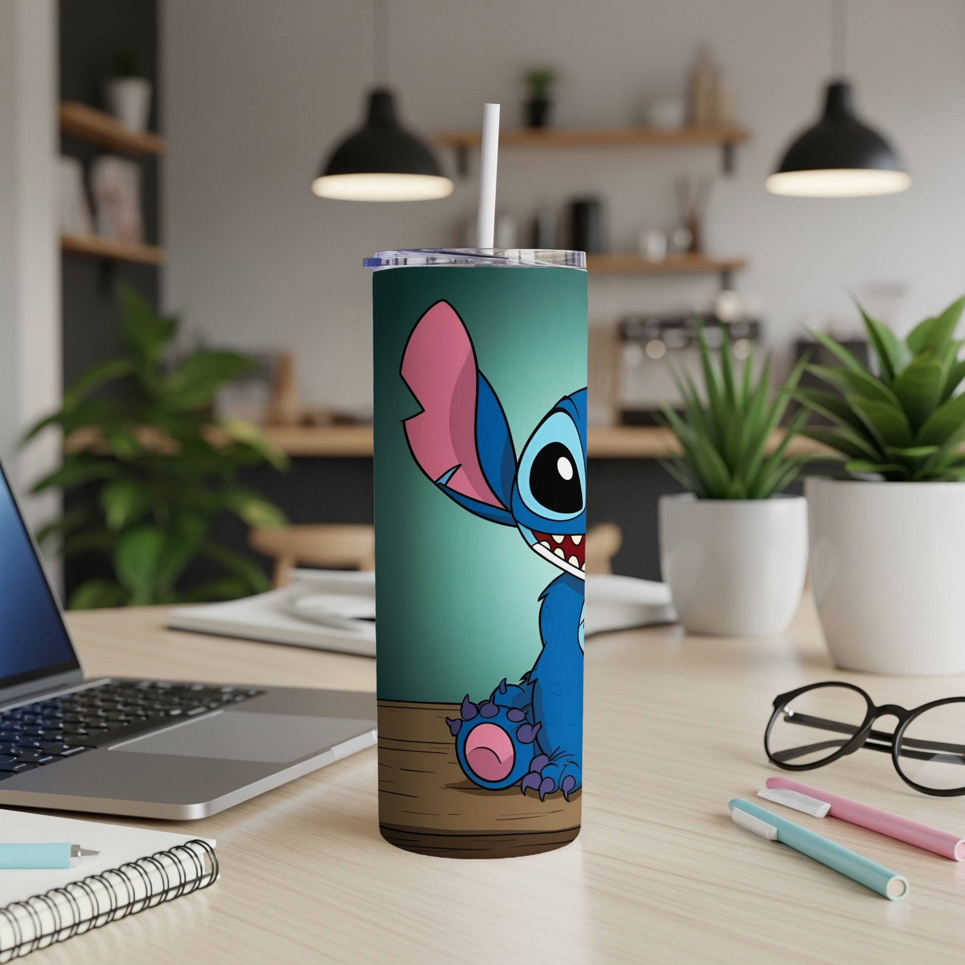 Stitch character on a teal tumbler with a straw.