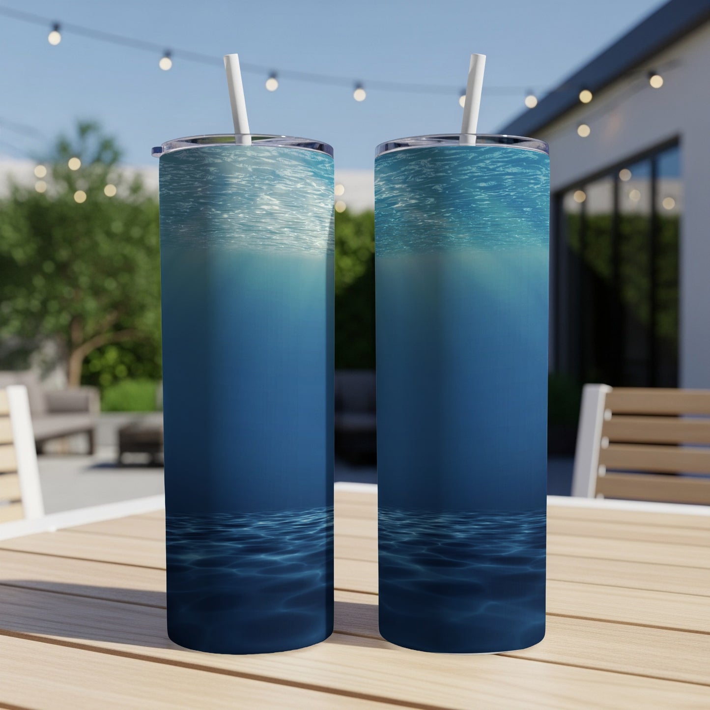 Two blue tumblers with underwater light and ripple design.