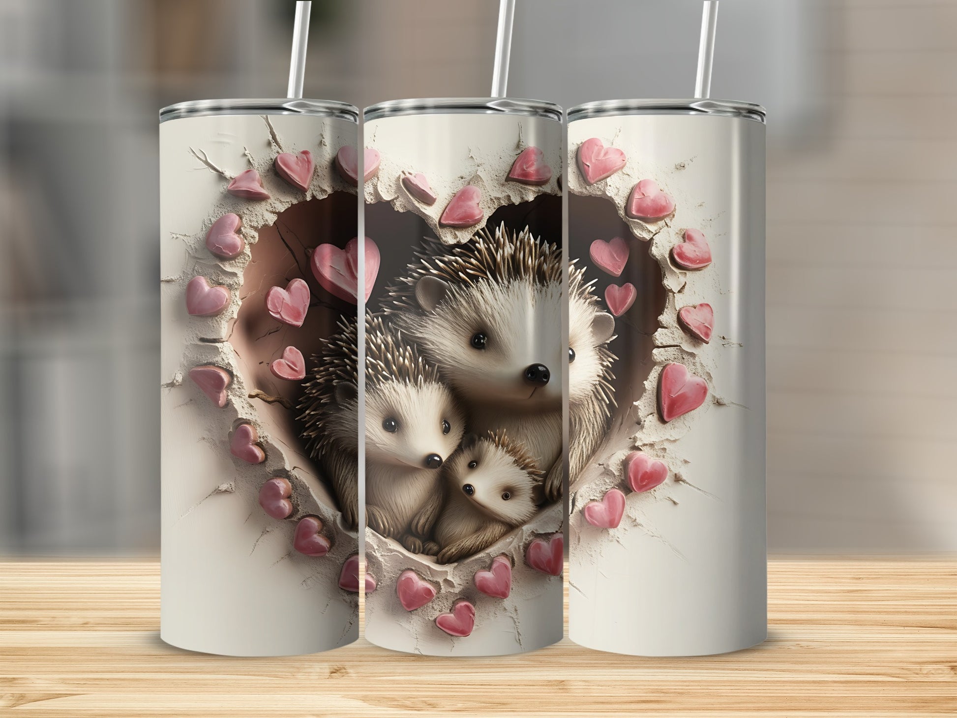 Three tumblers featuring a heart-shaped cutout revealing hedgehogs and pink hearts.