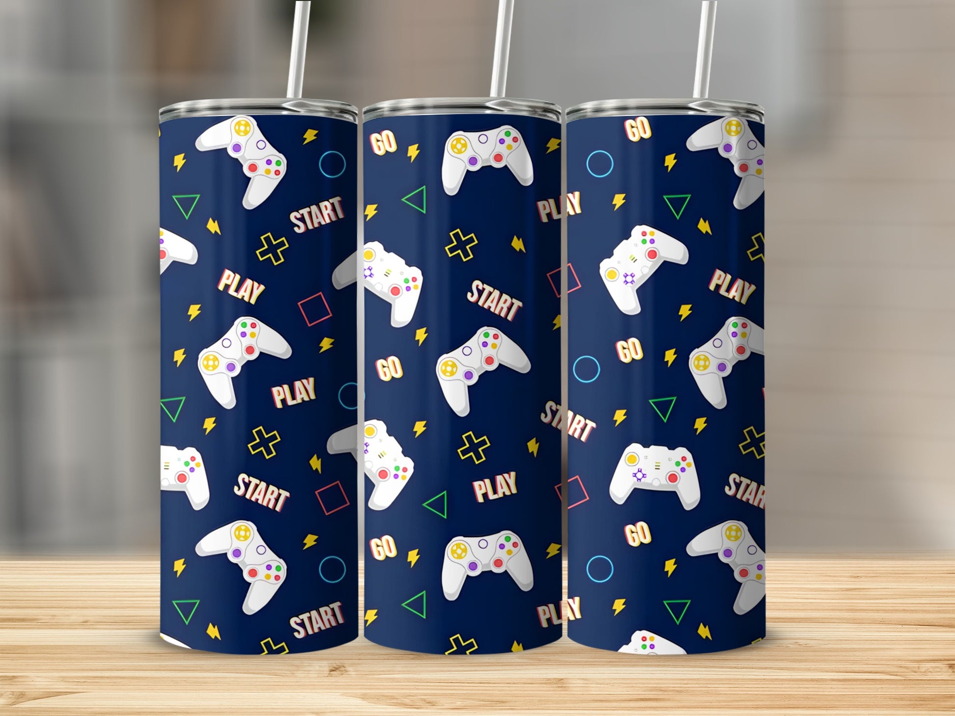Three tumblers with a navy background featuring video game controllers, play, start, and go text.