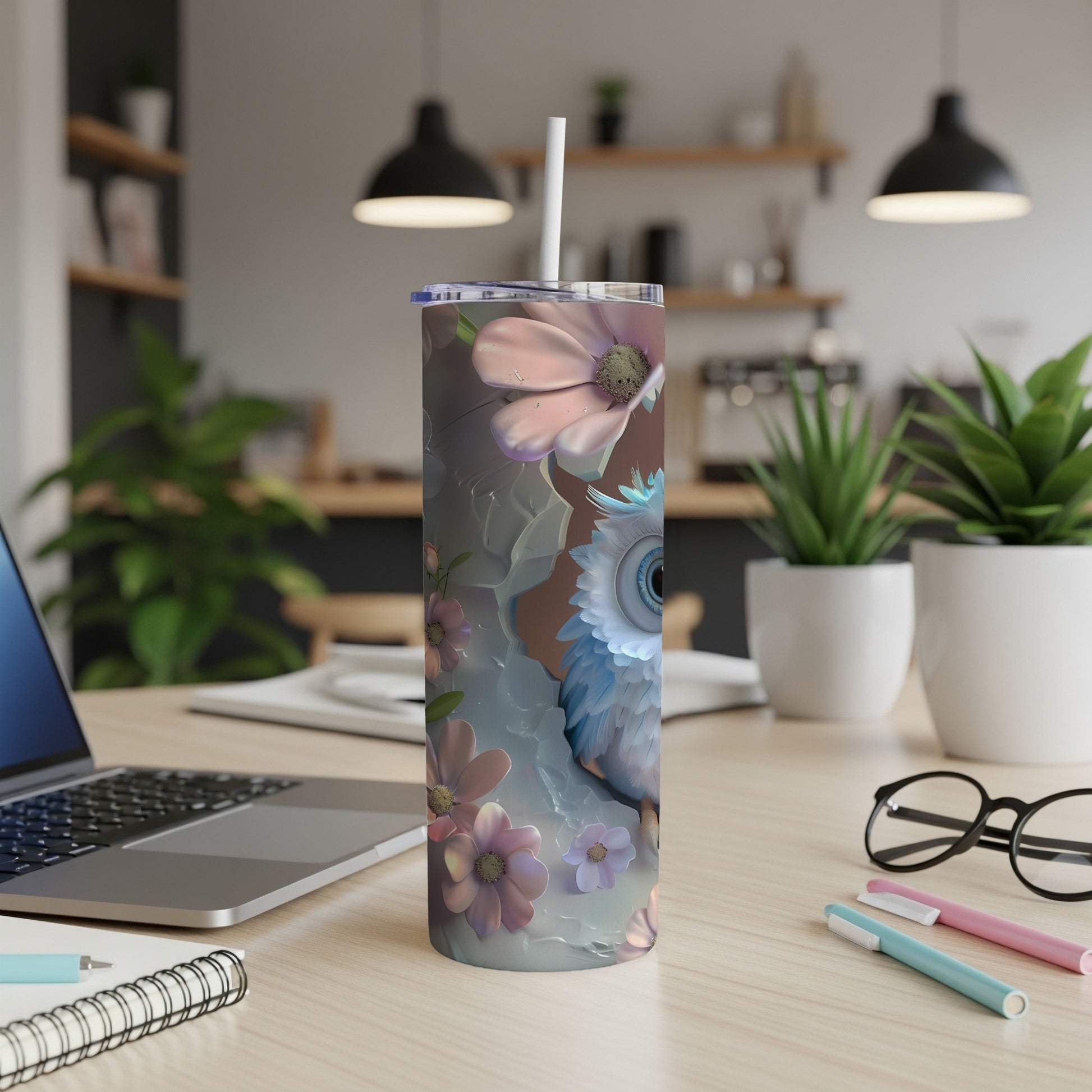Owl illustration with flowers on a tall tumbler with a straw.