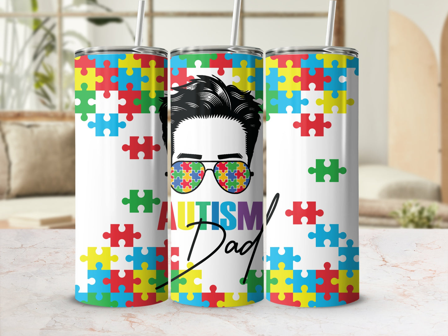 Tumbler with puzzle pieces, sunglasses reflecting a puzzle, and "Autism Dad" text.