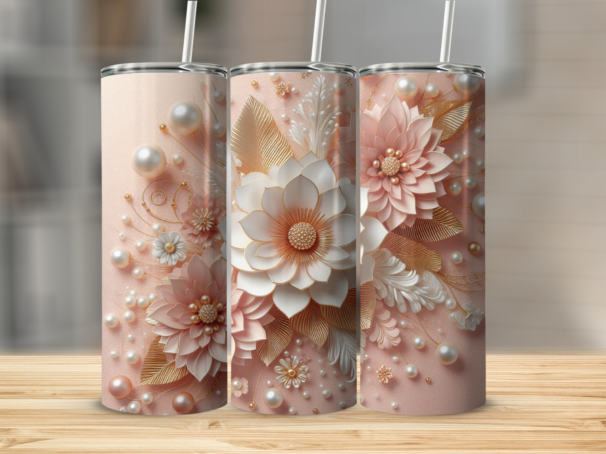 Three tall tumblers with pink floral and pearl designs.