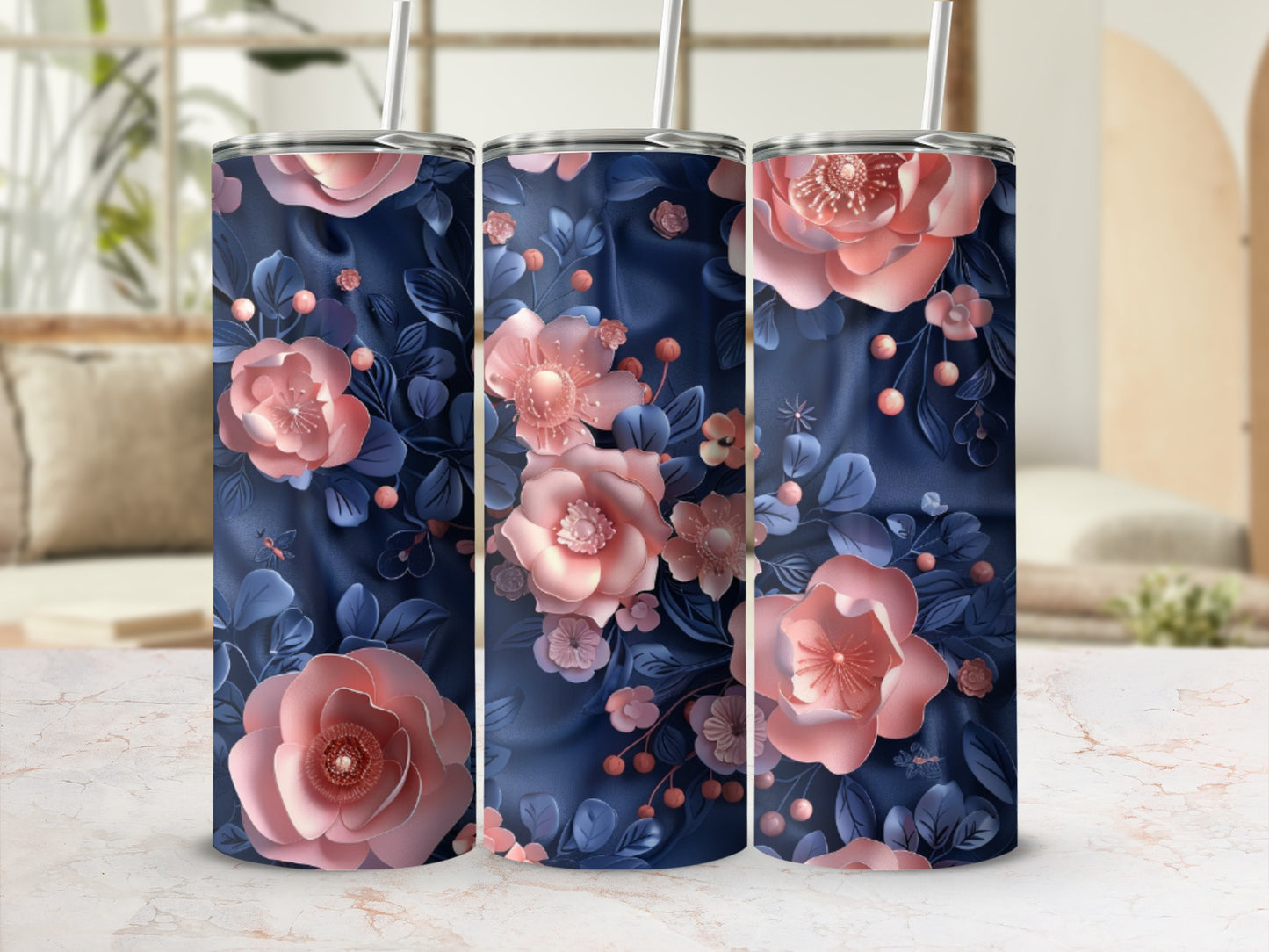 Three tumblers with floral pattern on a marbled surface.