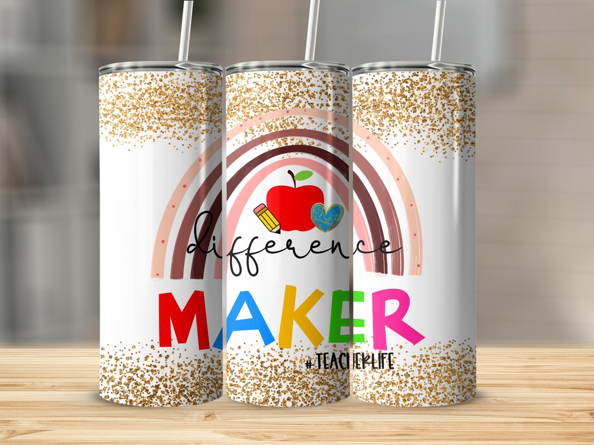 Rainbow and apple design with "difference MAKER #TEACHERLIFE" text on a tumbler.
