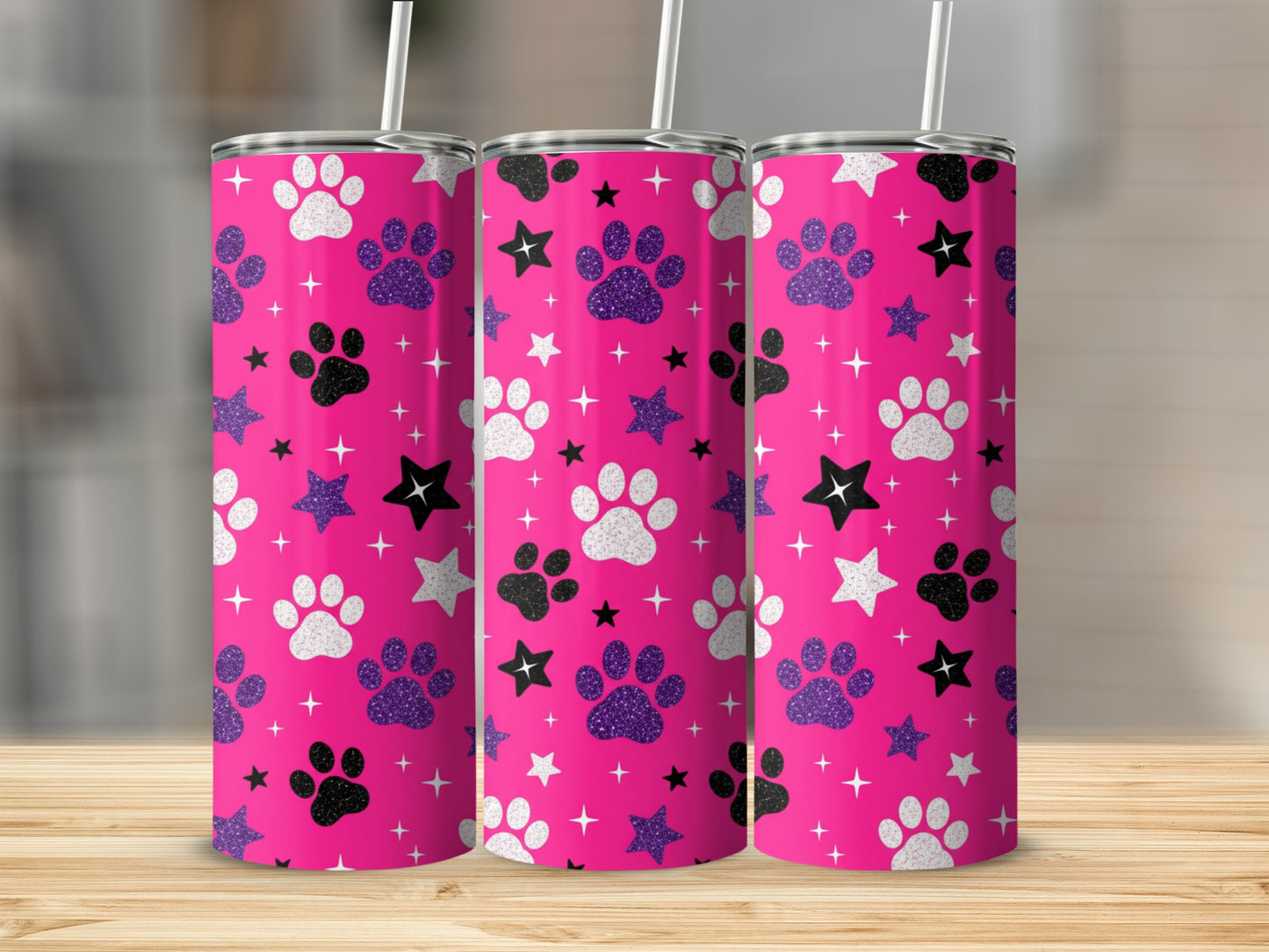 Three pink tumblers with white paw prints and glitter accents.