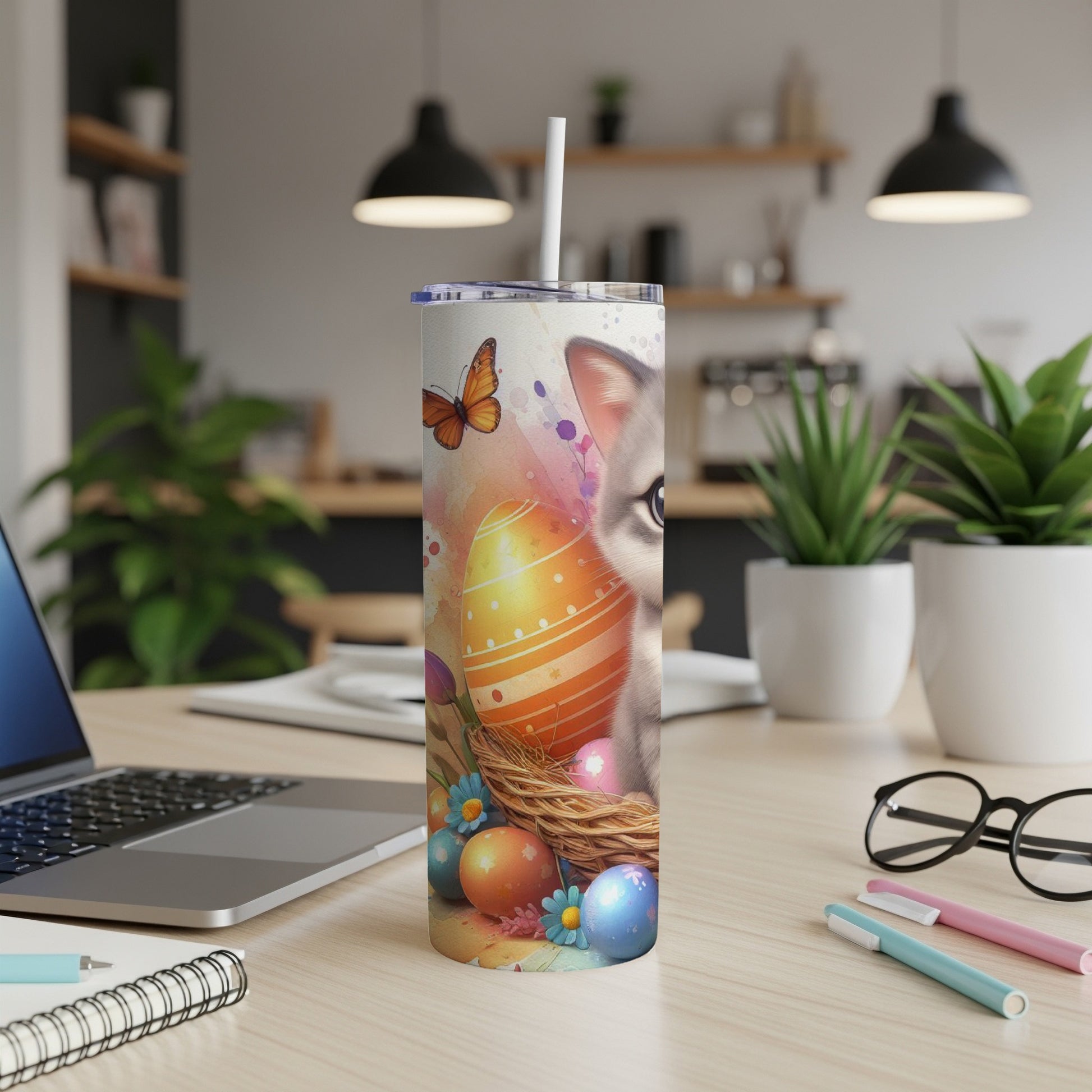 Easter-themed tumbler with a cat and painted eggs in a nest.