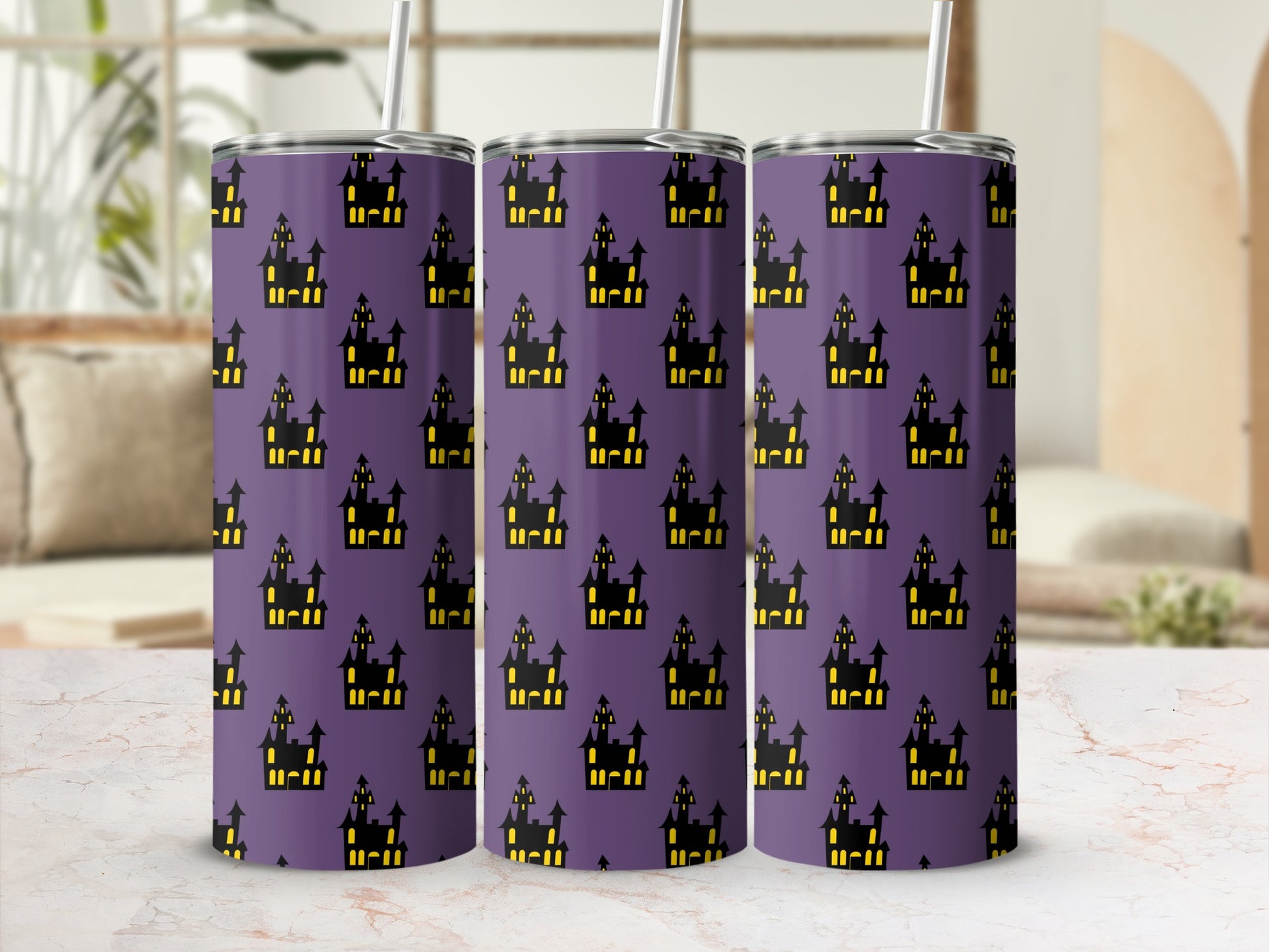 Three tumblers with a purple background and scattered black haunted house silhouettes.