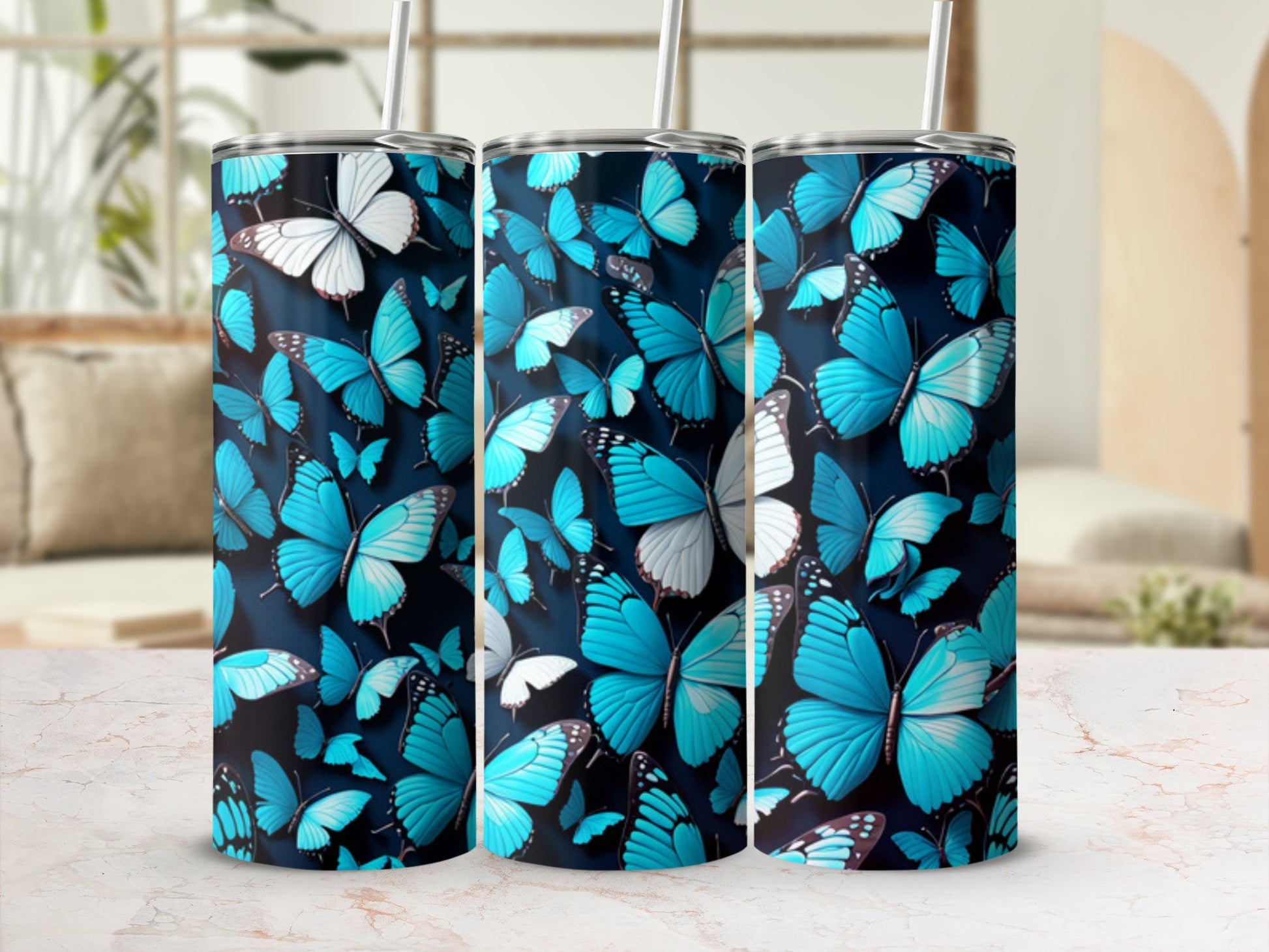 Blue butterflies with white accents on a dark background, displayed on three tumblers.