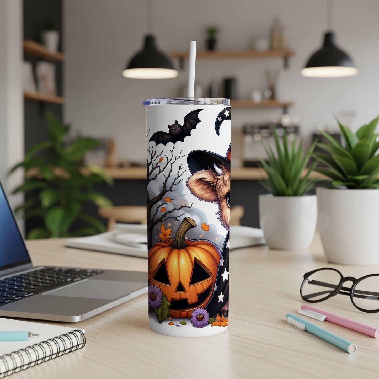 Halloween tumbler with pumpkin, bat, and cat wearing witch hat.